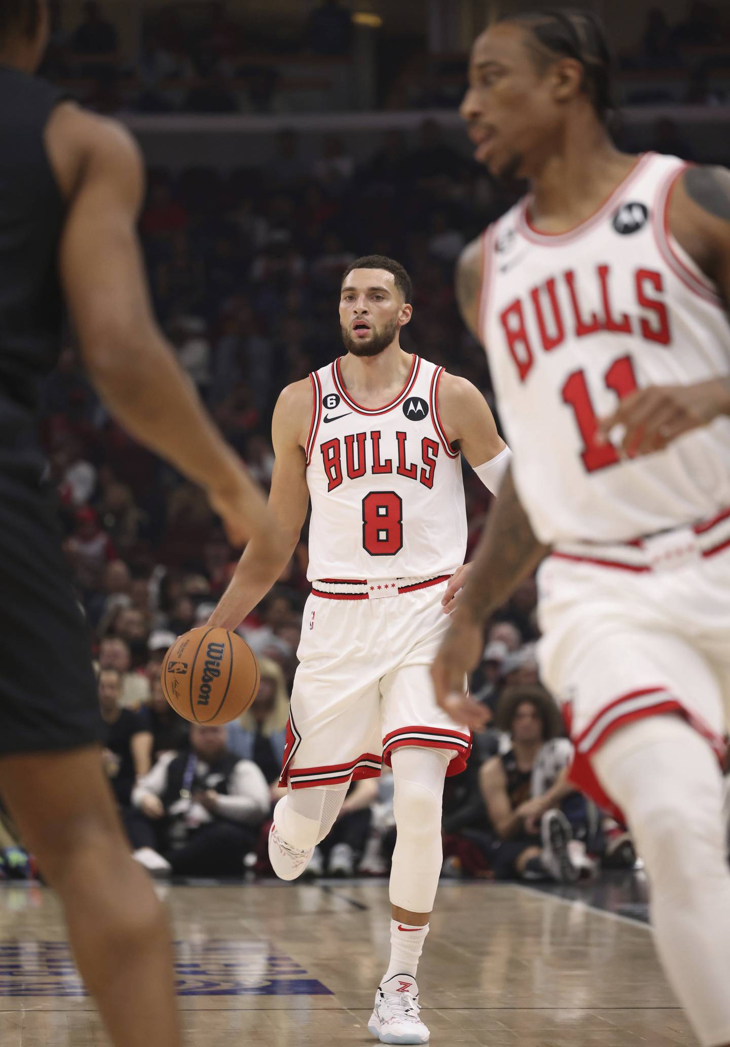 Bulls guard Zach LaVine (8) advances the ball in the first quarter against the Cavaliers on Saturday at the United Center. LaVine scored 23 points in his season debut, but the Bulls lost 128-96. 
