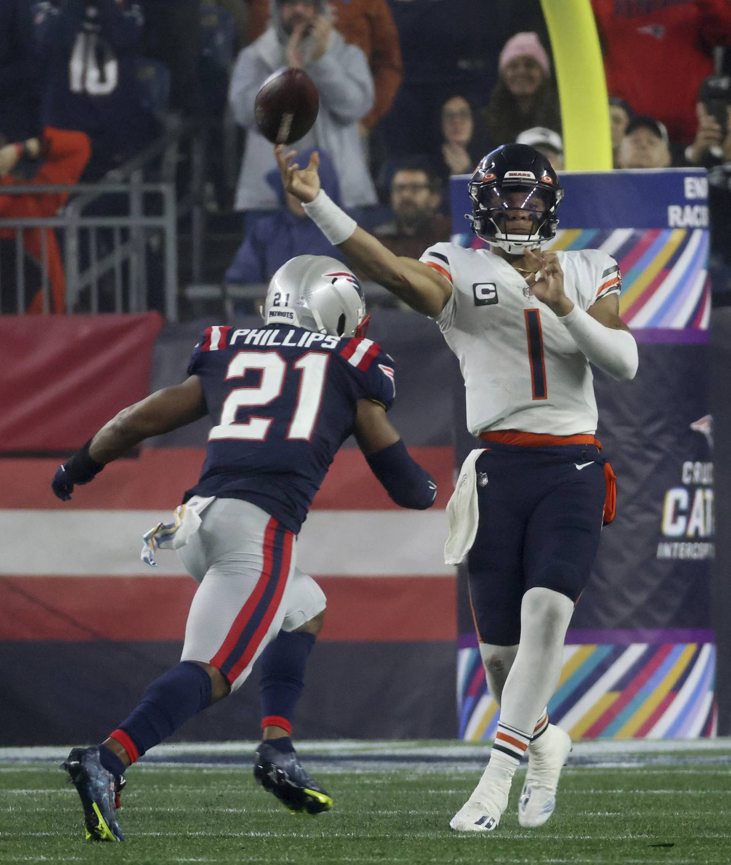 Bears quarterback Justin Fields releases the ball as Patriots safety Adrian Phillips) approaches in the third quarter at Gillette Stadium on Oct. 24, 2022.