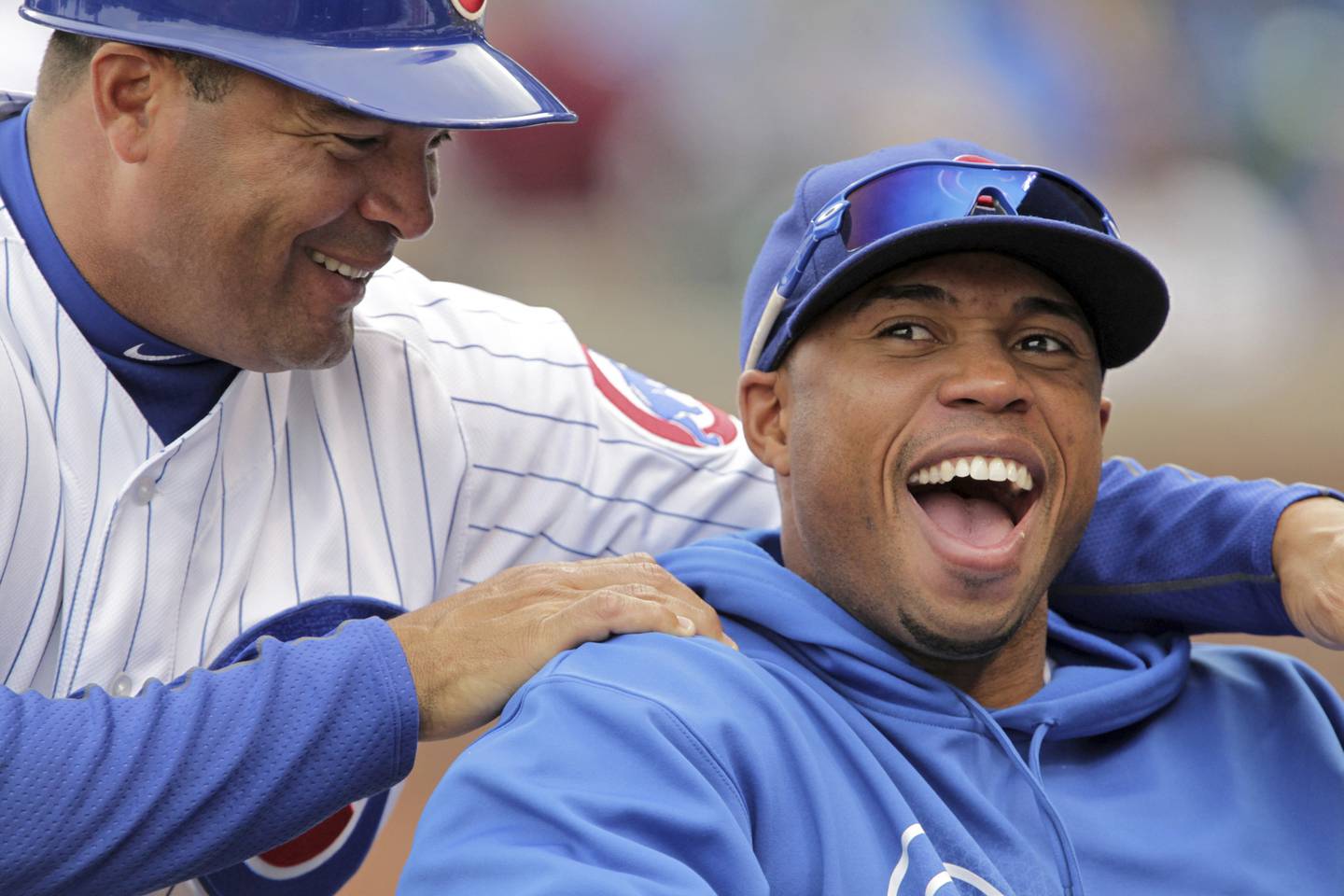 Cubs third-base coach Pat Listach, left, jokes with Luis Valbuena during a game on Oct. 3, 2012, at Wrigley Field. 