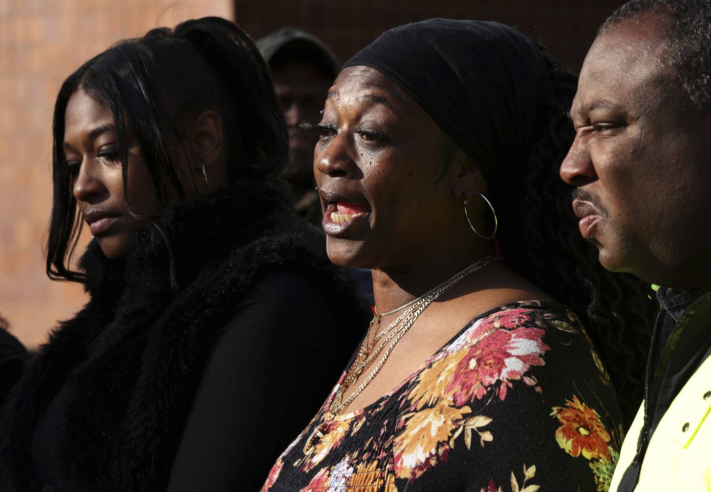 Lutia Payne Midcalf, center, the grandmother of an 11-year-old girl who was allegedly sexually assaulted last week, speaks outside Chicago police headquarters on Oct. 11, 2022.  