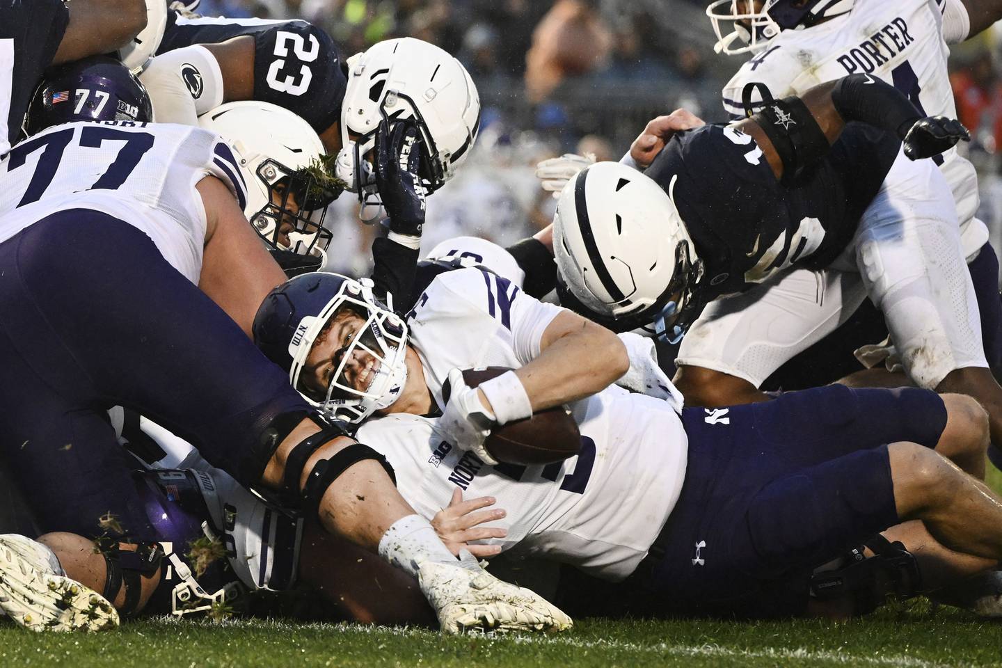 Northwestern quarterback Ryan Hilinski is stopped short of the end zone on fourth-and-goal against Penn State defenders Ji'Ayir Brown (16) and Curtis Jacobs during the fourth quarter Saturday in State College, Pa. 