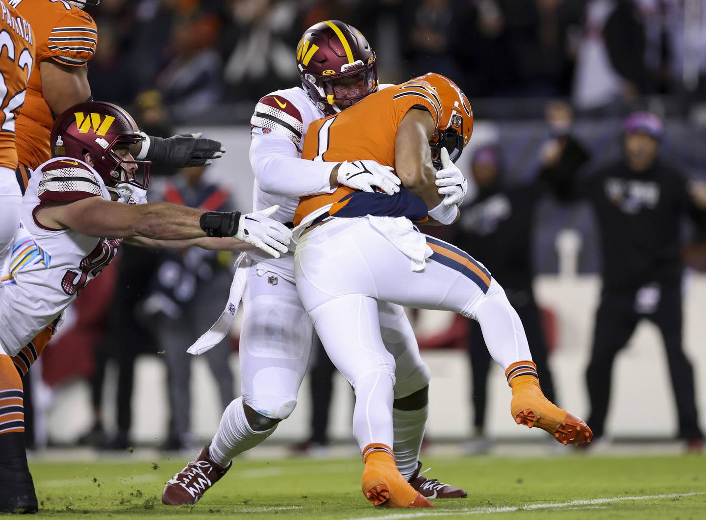 Commanders defensive tackle Daron Payne (94) sacks Bears quarterback Justin Fields (1) on Oct. 13, 2022, at Soldier Field.