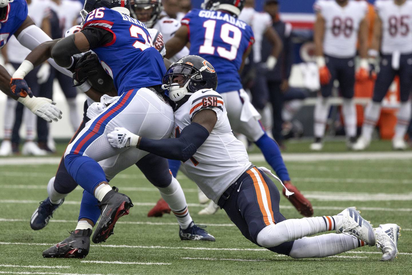 Bears safety Eddie Jackson takes down Giants running back Saquon Barkley during the first quarter on Oct. 12, 2022, at MetLife Stadium.