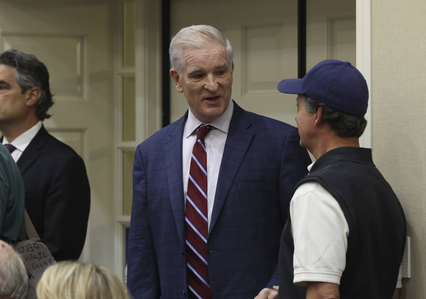 Mark Curran, Republican candidate for the Illinois Supreme Court, center, talks with a supporter at a meet-and-greet held by the Women's Republican Club of Lake Forest-Lake Bluff at the Gorton Community Center in Lake Forest on Oct. 12, 2022.  