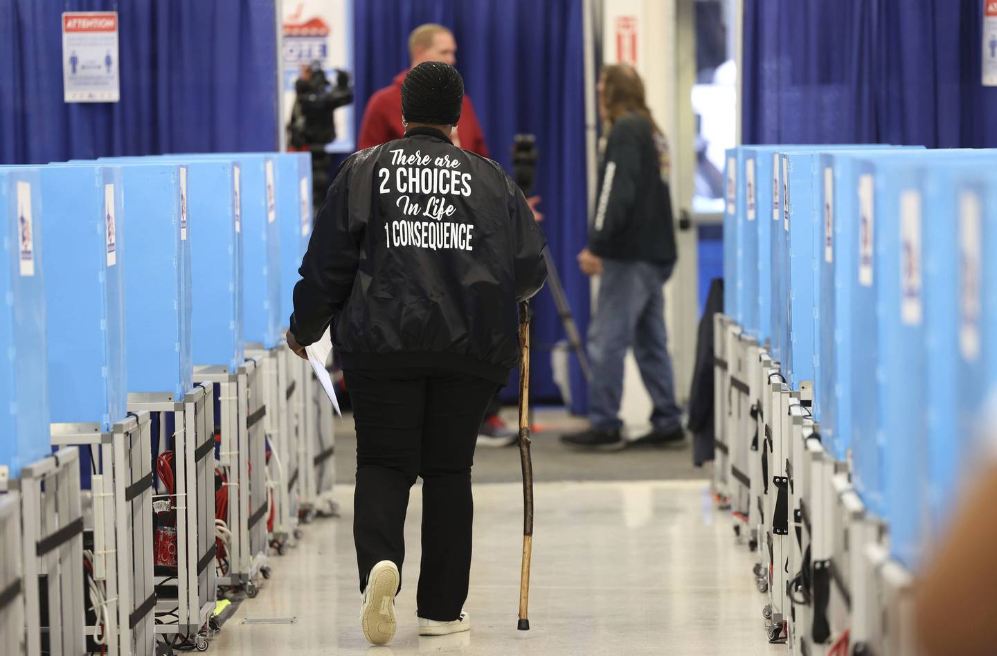 People leave after voting on the first day of early voting at the Chicago Board of Elections Super Site on Oct. 7, 2022.  
