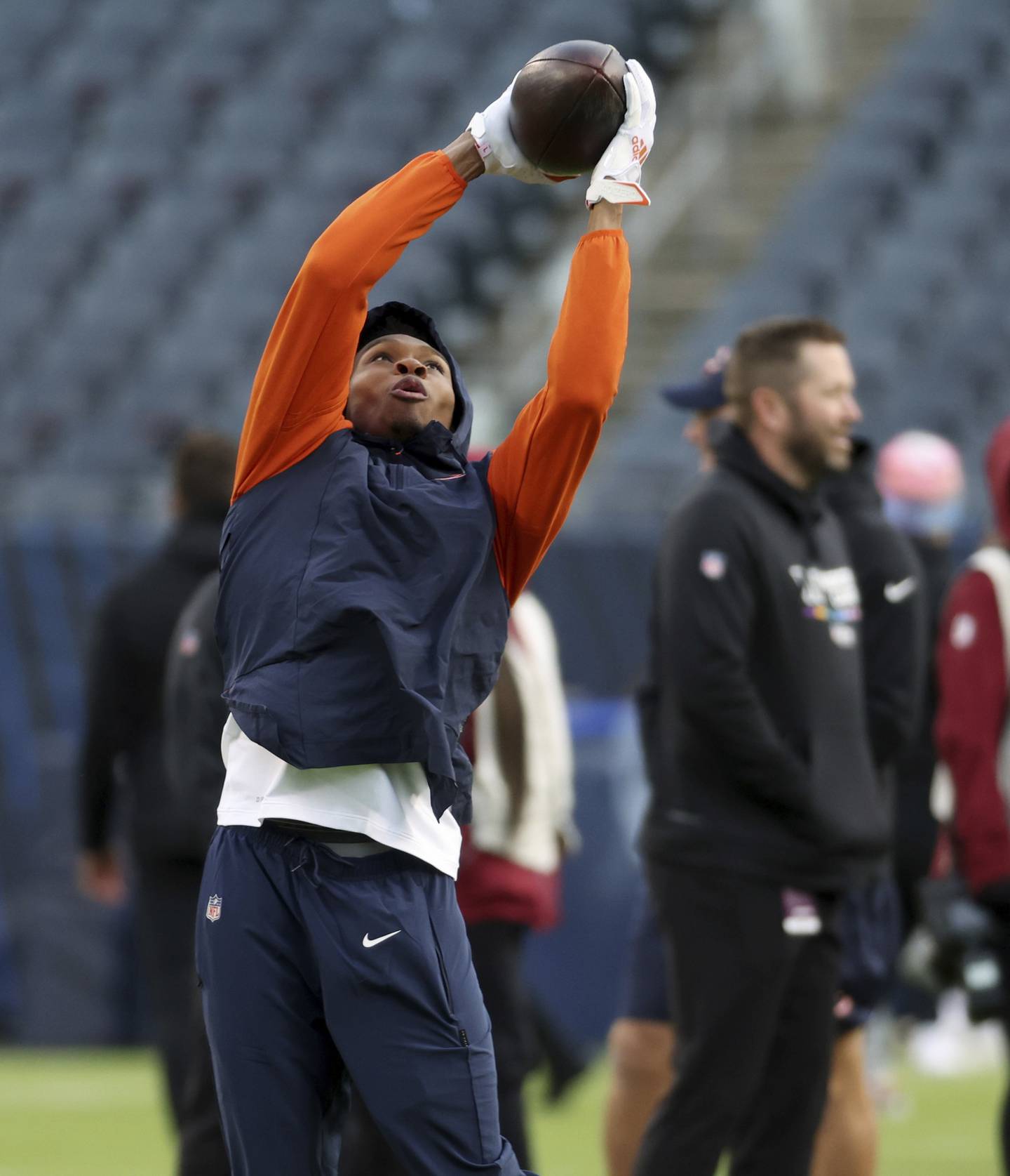 Bears wide receiver Darnell Mooney warms up for a game against the Commanders at Soldier Field on Oct. 13, 2022.