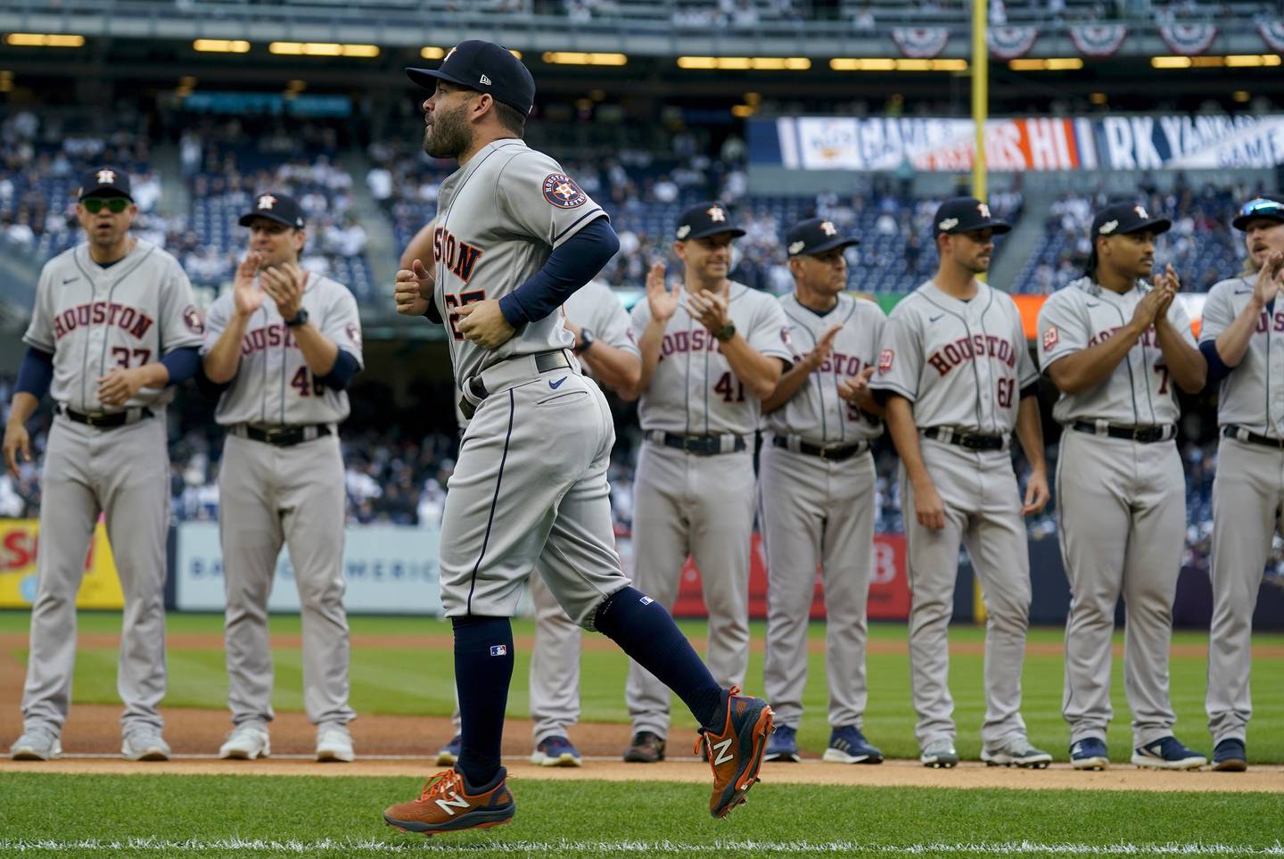 Astros second baseman Jose Altuve runs onto the field during player introductions before Game 3 of the American League Championship Series against the Yankees on Saturday in New York. 