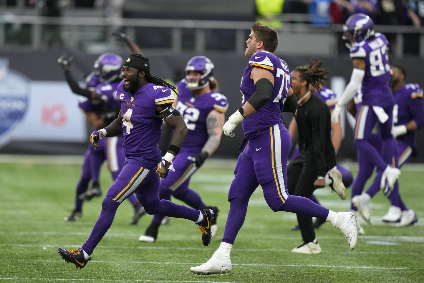Vikings players celebrate after beating the Saints on Sunday, Oct. 2, 2022, at Tottenham Hotspur Stadium in London.