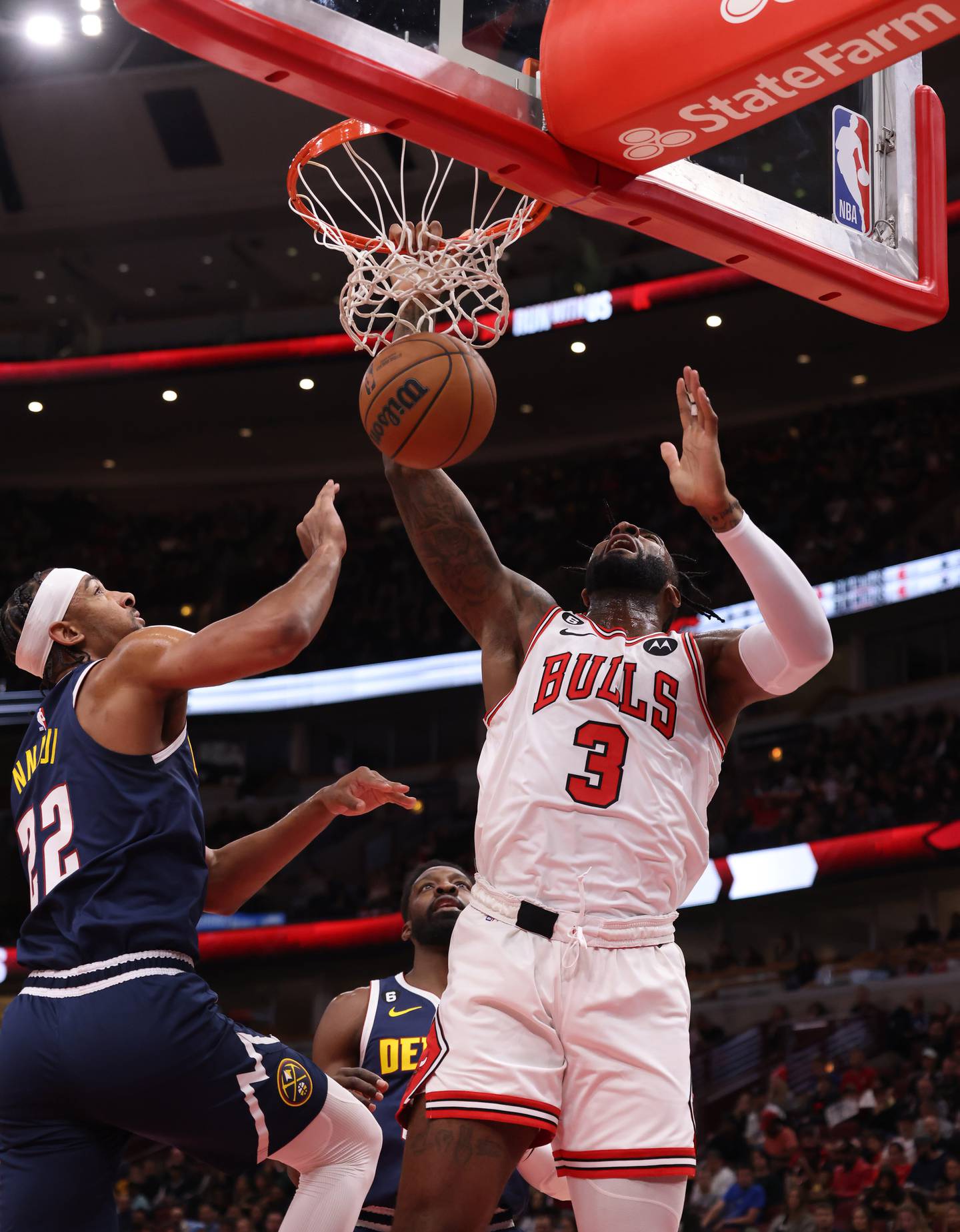 Bulls center Andre Drummond dunks in the second quarter of a preseason game against the Nuggets on Friday at the United Center. 