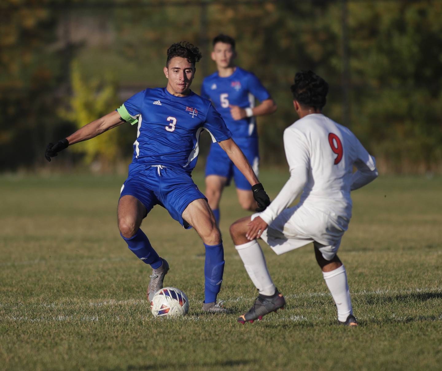 Marmion’s Ricardo Saucedo (3) moves the ball against Oswego’s Jersaih Avalos (9) during a nonconference game in Aurora on Wednesday, Oct. 12, 2022.