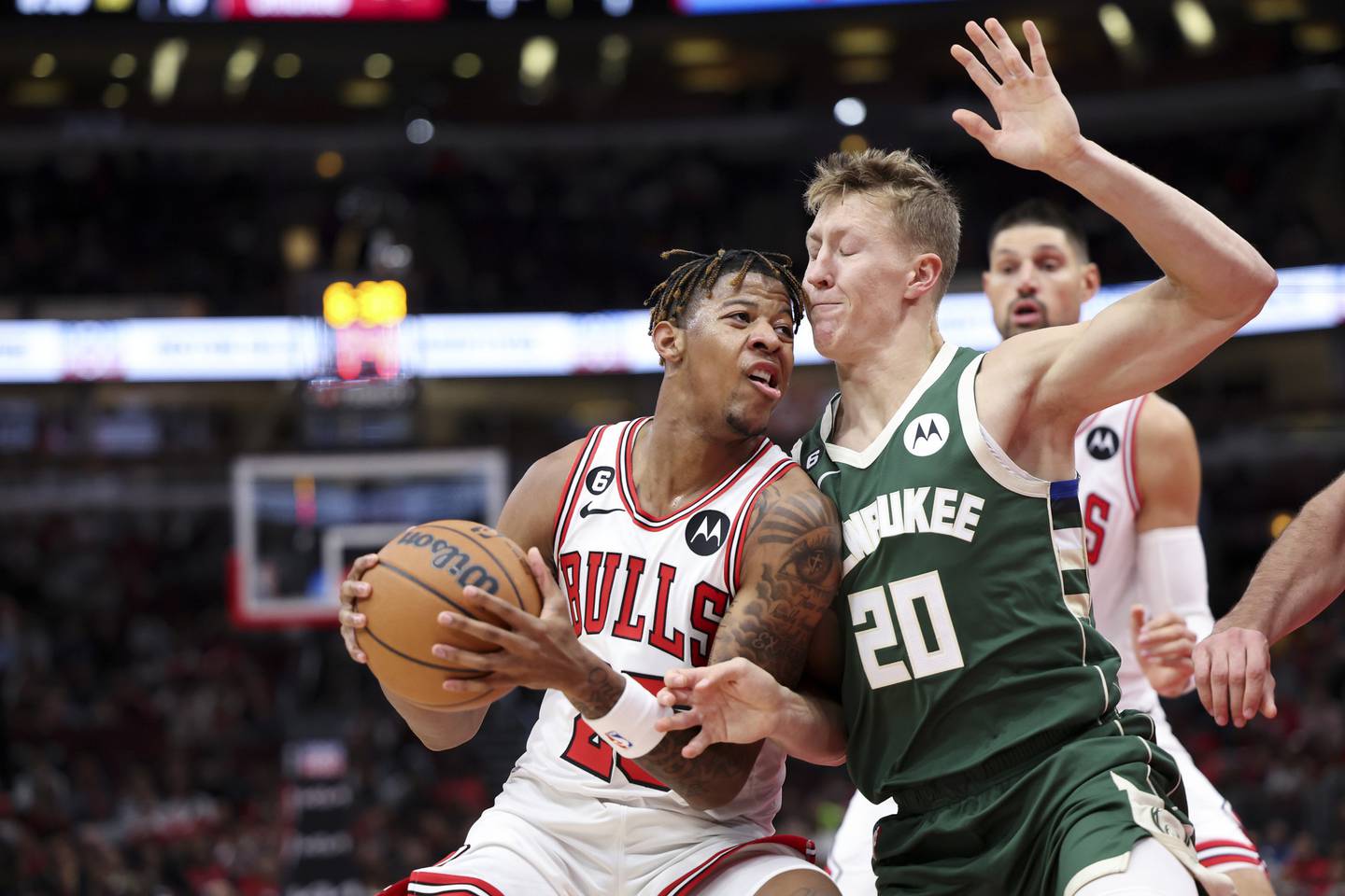 Bulls rookie guard Dalen Terry, left, drives against Bucks guard AJ Green during a preseason game Tuesday at the United Center. 