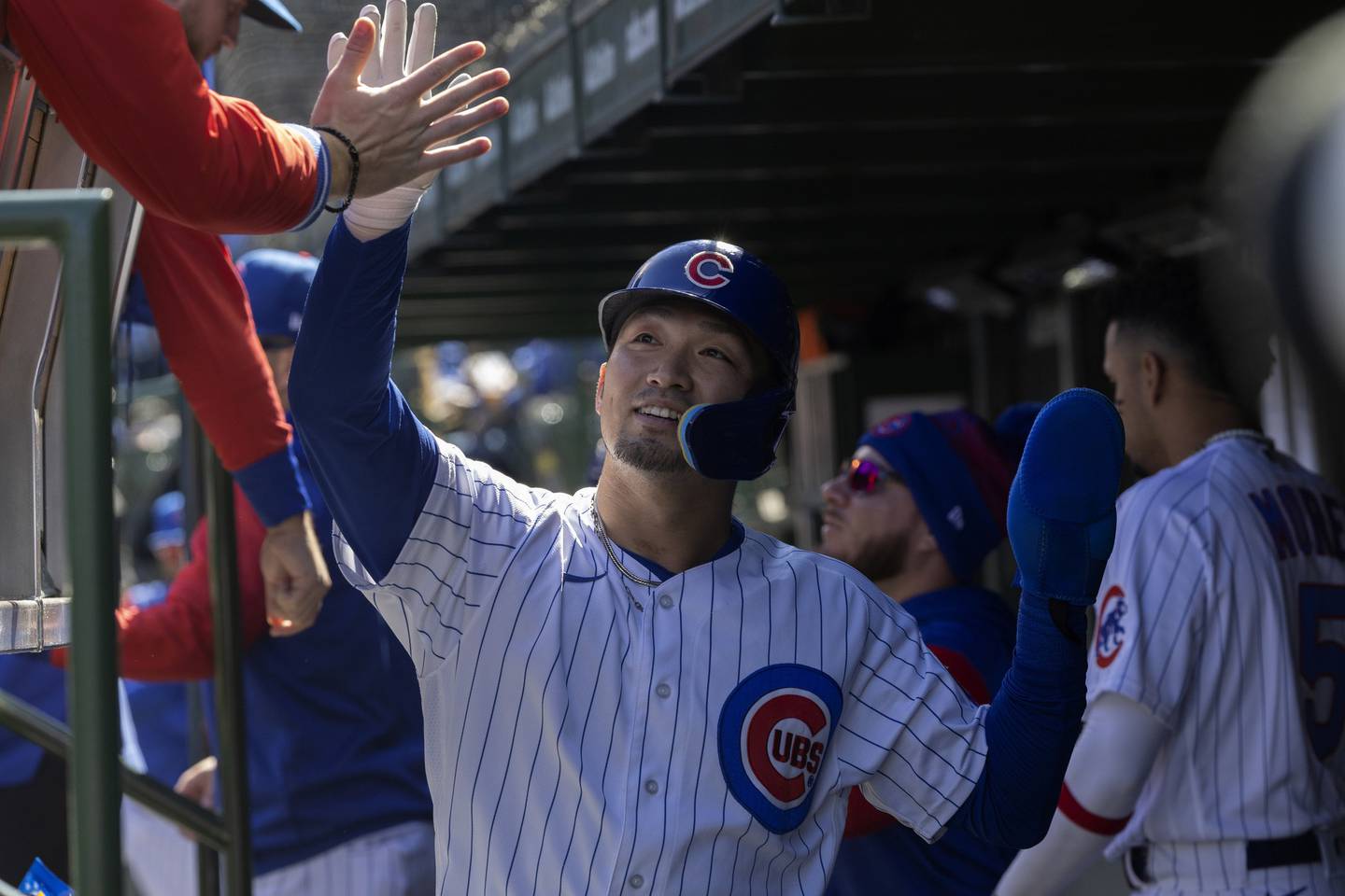 Cubs right fielder Seiya Suzuki celebrates after scoring on a first-inning double by Patrick Wisdom against the Phillies on Sept. 29, 2022, at Wrigley Field.