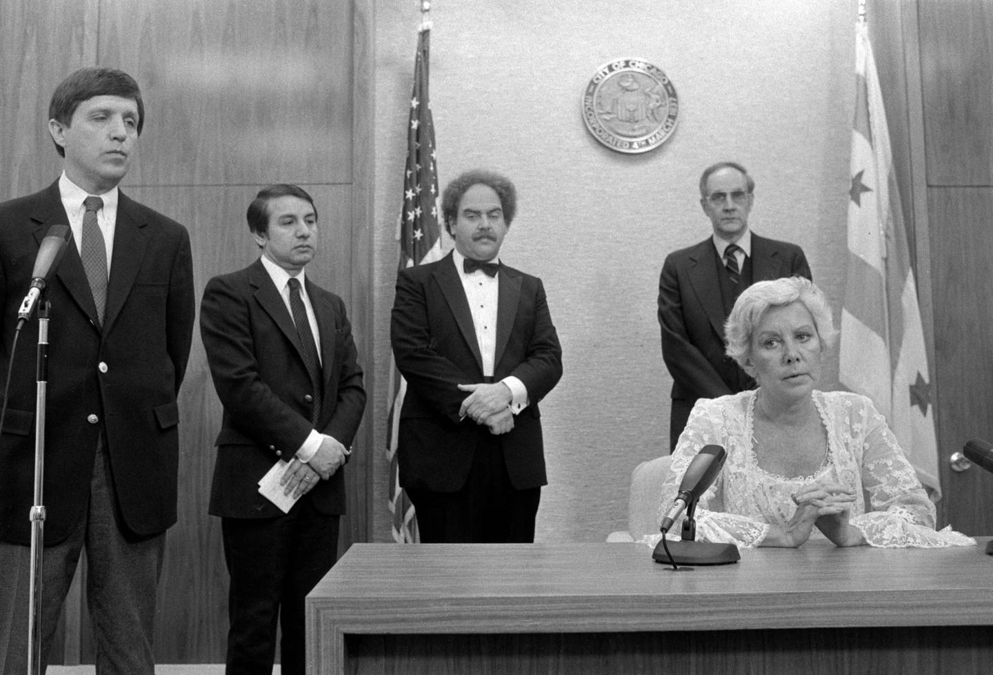 Chicago Mayor Jane Byrne, at right, holds a midnight news conference about a Chicago woman dying from tainted Tylenol. Chicago police Superintendent Richard Brzeczek is at left. Byrne is wearing a formal dress she'd donned for an evening event.
