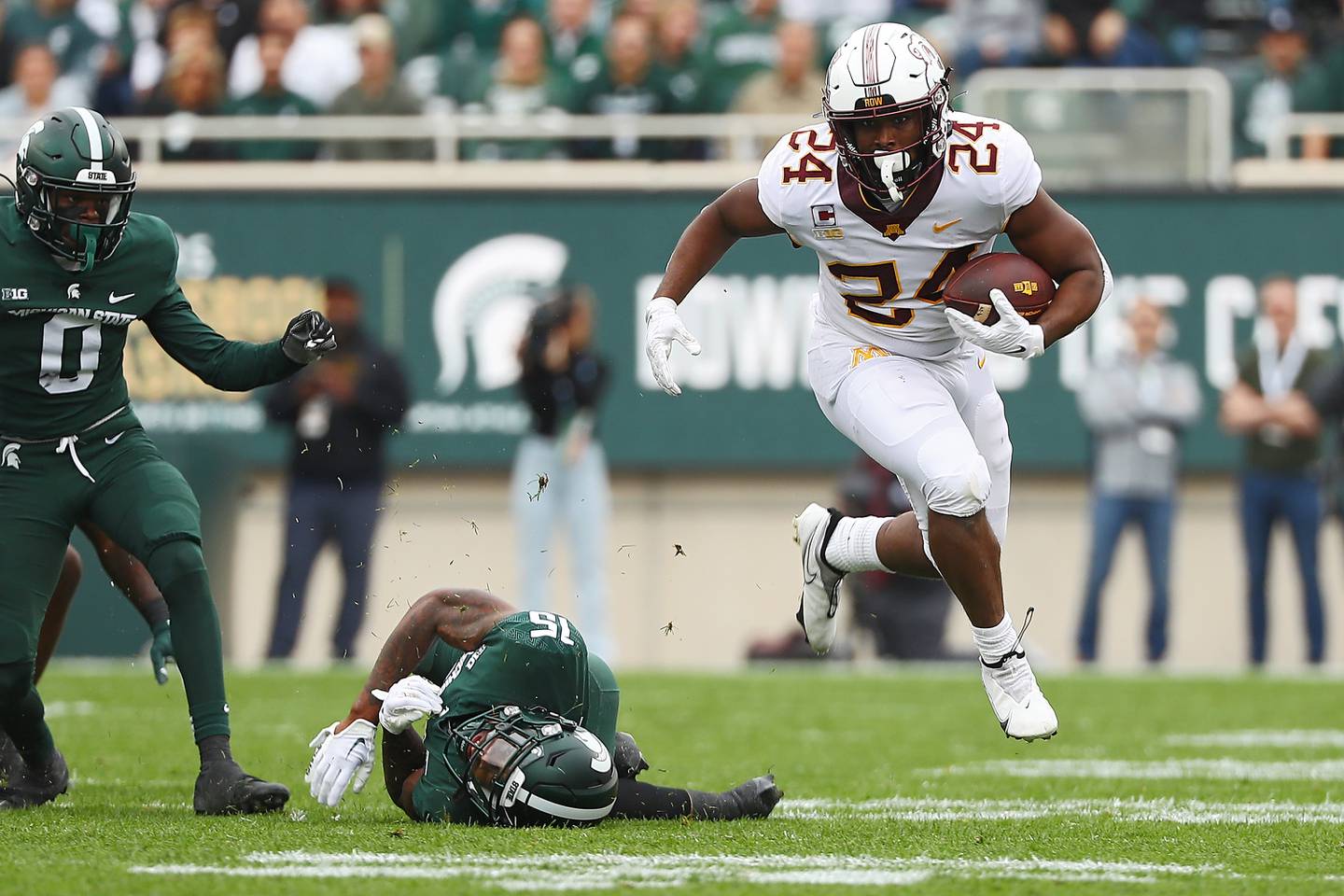 Minnesota's Mohamed Ibrahim skips through a tackle attempt by Michigan State's Angelo Grose in the first half at Spartan Stadium on Sept. 24 in East Lansing, Michigan.