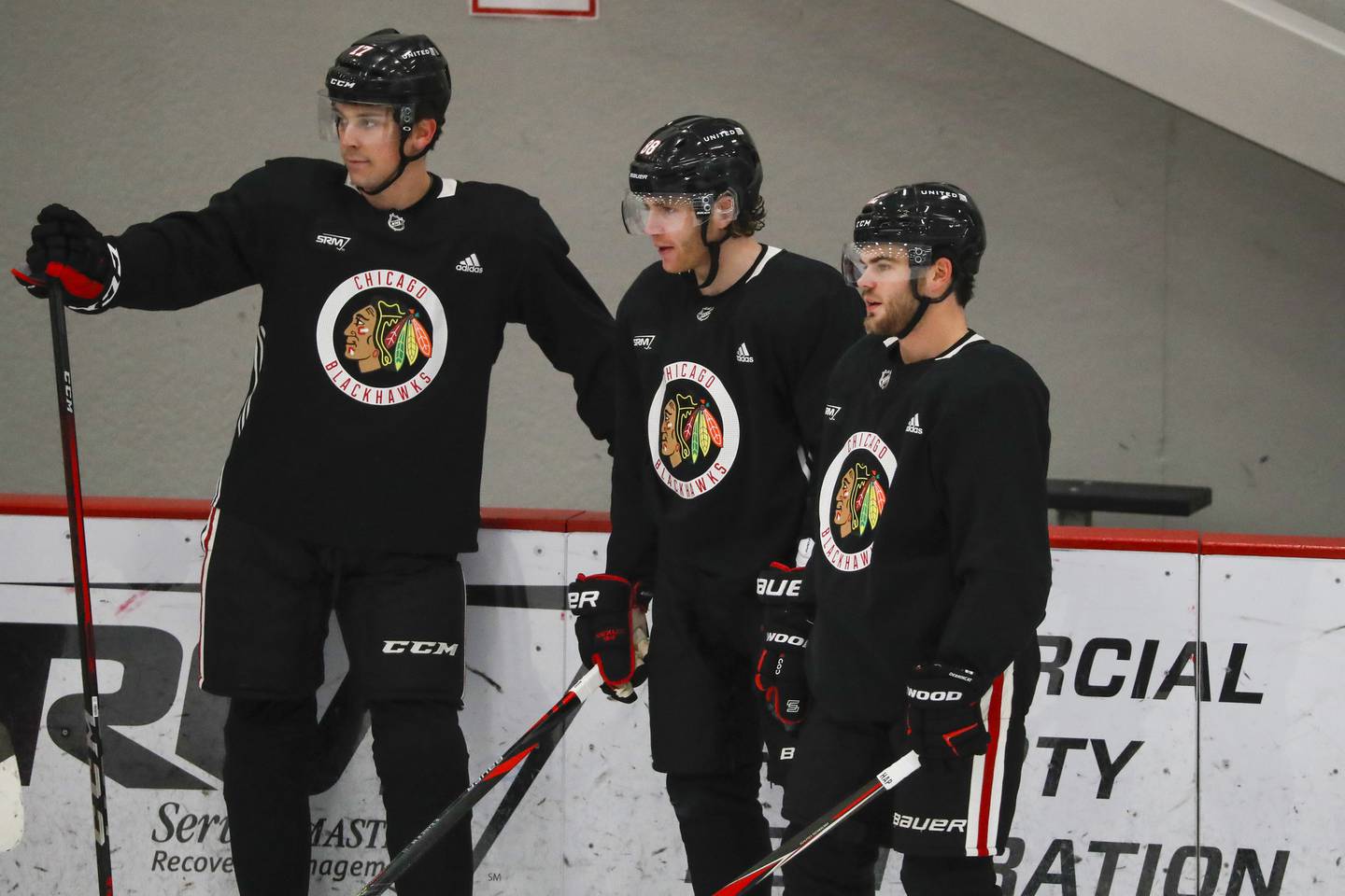 Blackhawks center Dylan Strome, from left, right wing Patrick Kane and left wing Alex DeBrincat watch practice at Fifth Third Arena on Jan. 6, 2021.