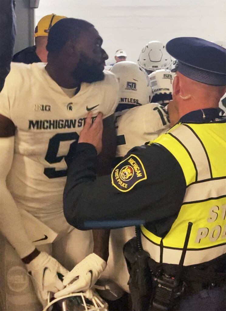 Michigan coach Jim Harbaugh expects ‘criminal charges’ for 4 Michigan State football players after postgame fight
