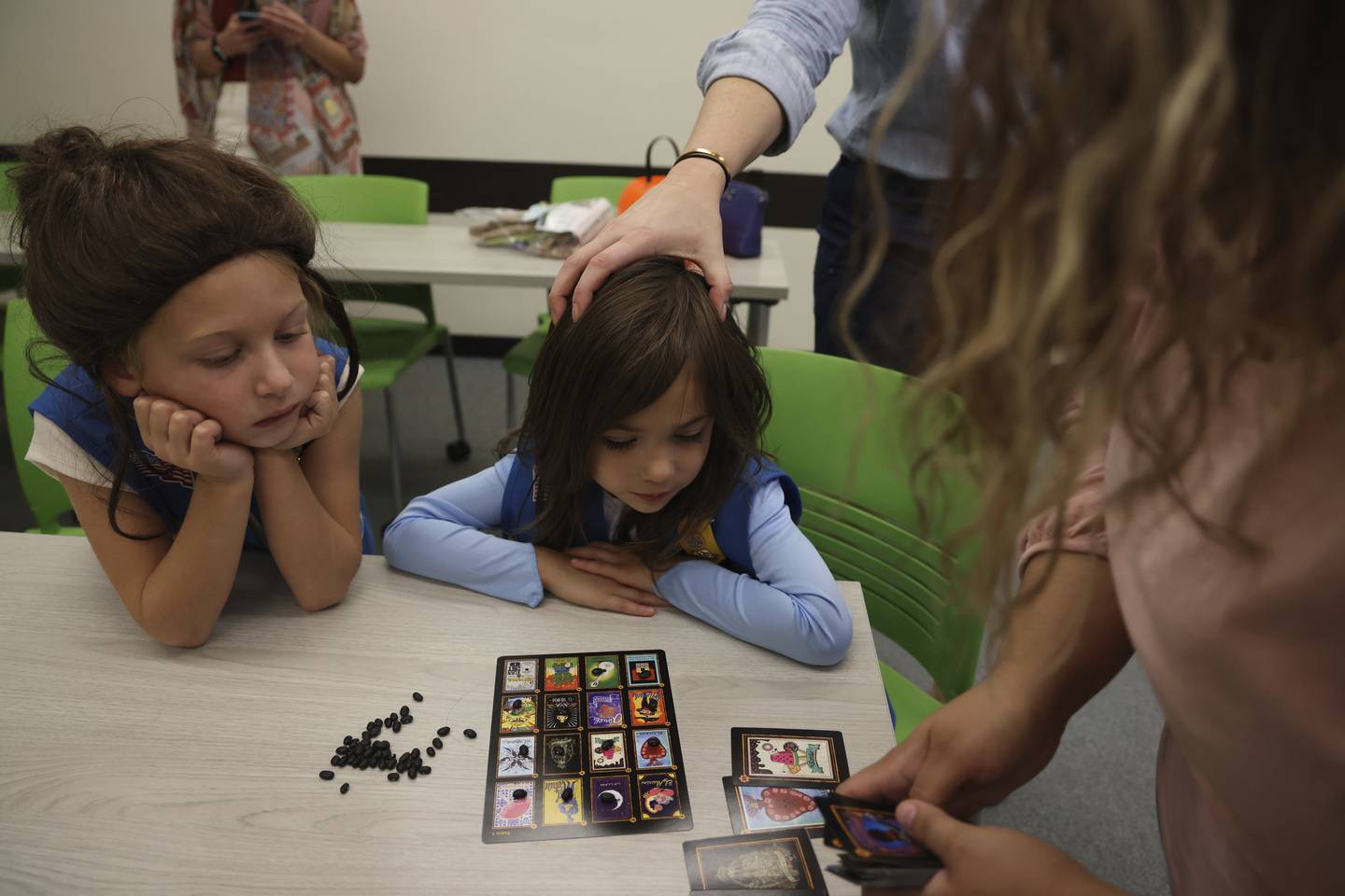 Della Duax, 6, left, and Ava Martinez, 5, right, watch to see if they've won during a card game at a Girl Scouts event at Elmhurst University on Oct. 23, 2022. Philanthropist MacKenzie Scott is giving $4.2 million to the Girl Scouts of Greater Chicago and Northwest Indiana.