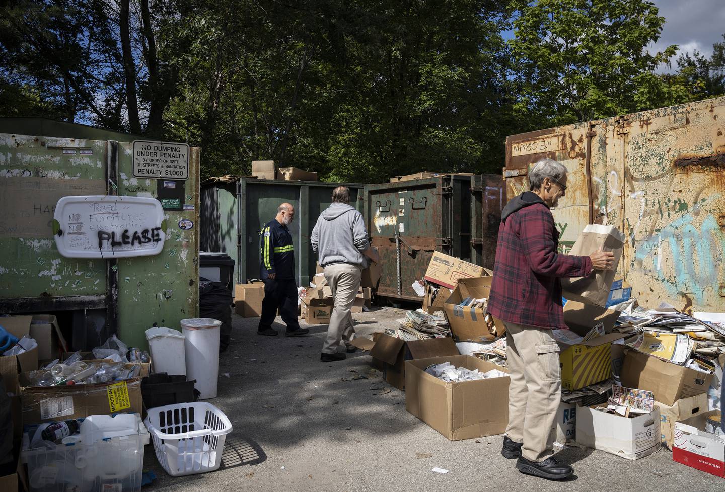 Residents drop off recyclables at the North Park Village Recycling Station drop-off site on Sept. 27, 2022.