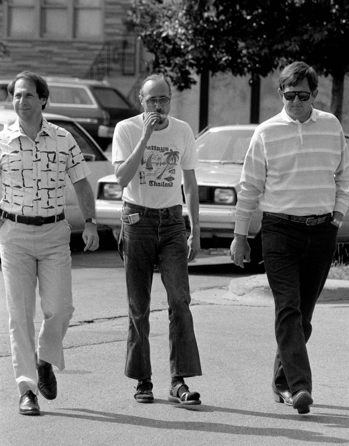 Roger Arnold, center, surrenders to police in connection with the fatal shooting of John Stanisha in 1983. Arnold, who was convicted, remained haunted by the murder for years, friends said.
