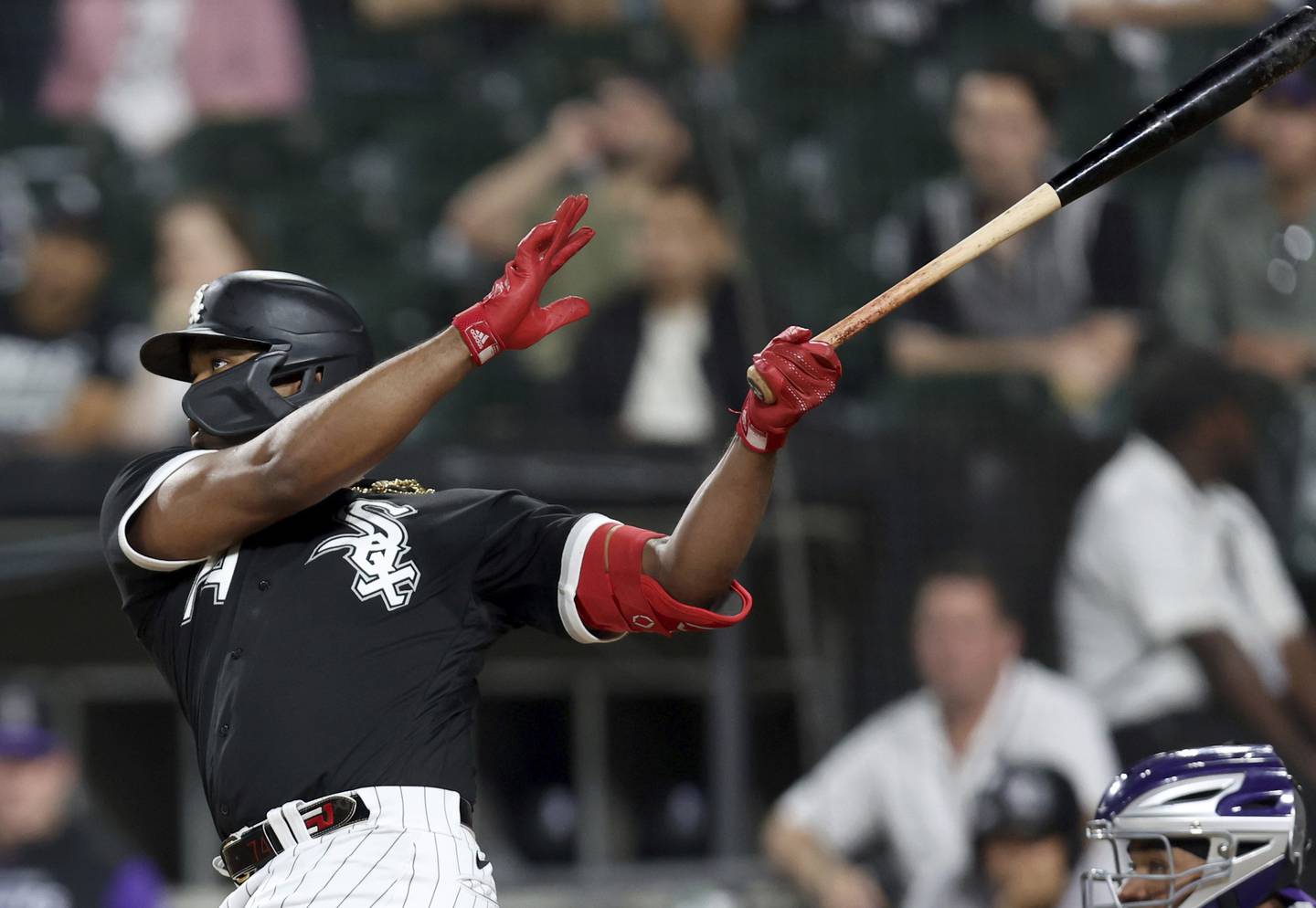 White Sox left fielder Eloy Jimenez hits a three-run home run in the first inning against the Rockies on Sept. 13 at Guaranteed Rate Field. 