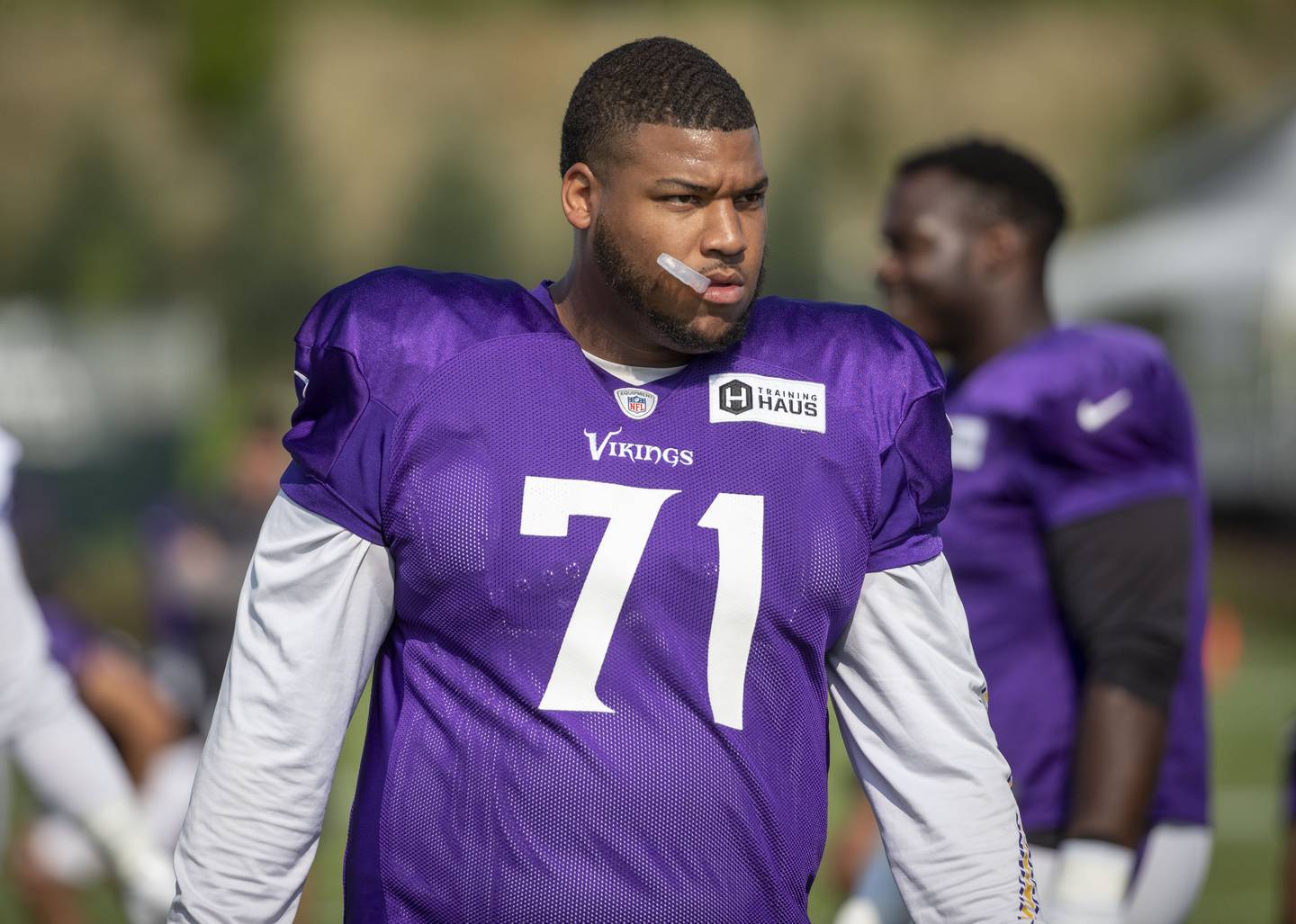 Vikings tackle Christian Darrisaw prepares for drills during training camp on Aug. 17 in Eagan, Minn.