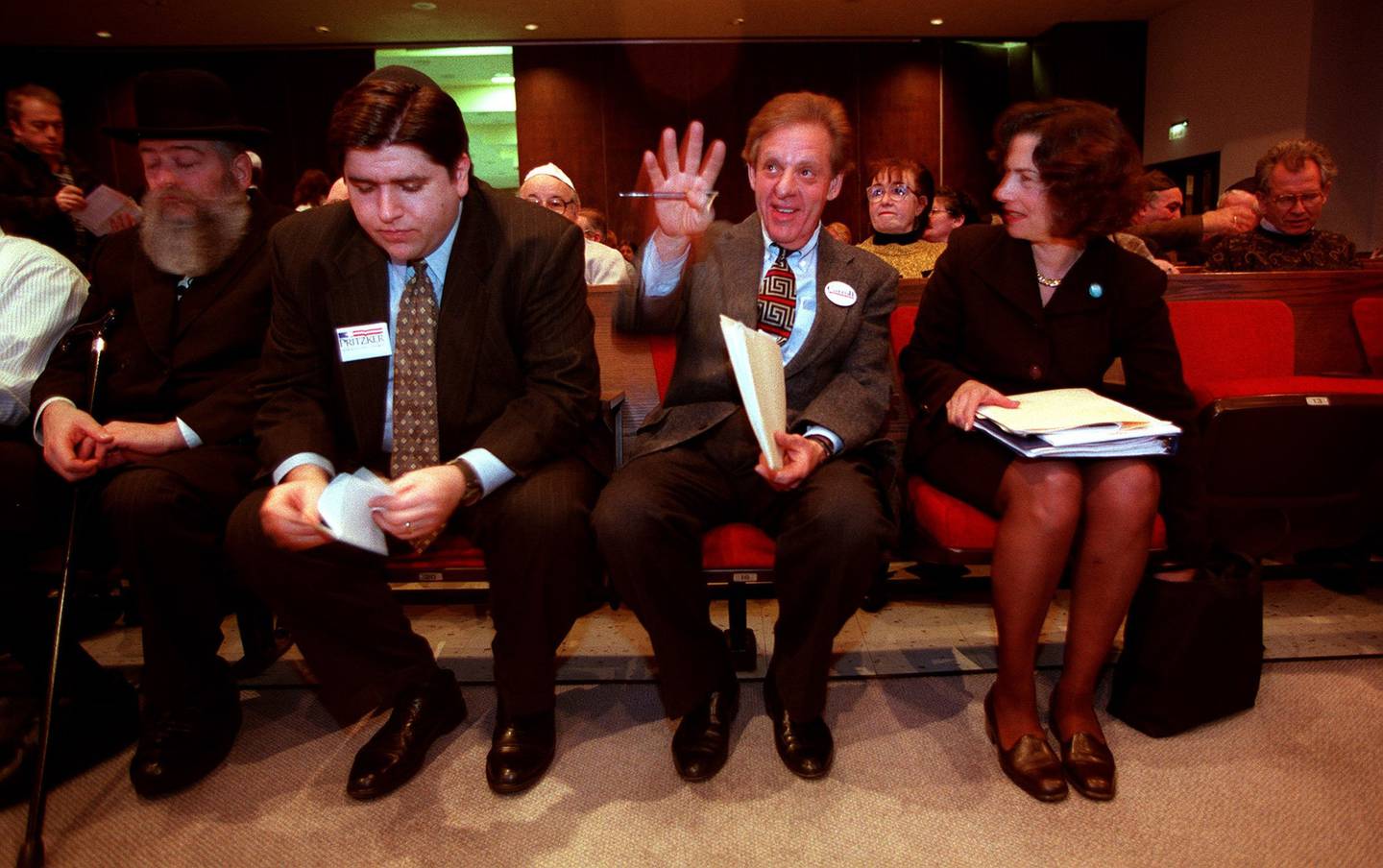 J.B. Pritzker, second from left, checks his notes in 1998 while he and Howard Carroll and Jan Schakowsky await their cue to take the stage for a debate in the Democratic campaign for the 9th Congressional District. Schakowsky won the Democratic nomination for the seat vacated by retiring U.S. Rep. Sidney Yates.