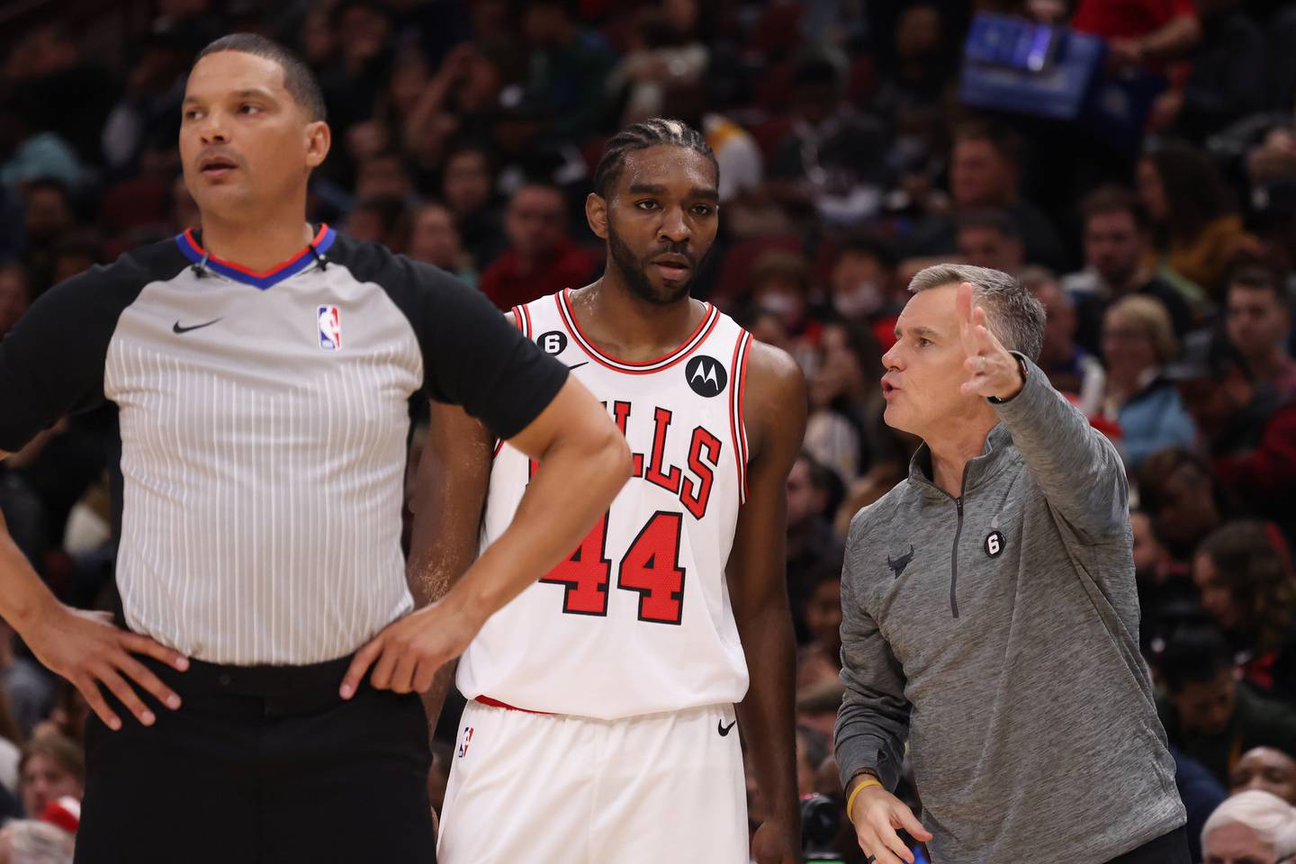 Bulls coach Billy Donovan, right, talks with forward Patrick Williams in the second quarter of a preesason game against the Nuggets on Oct. 7 at United Center. 