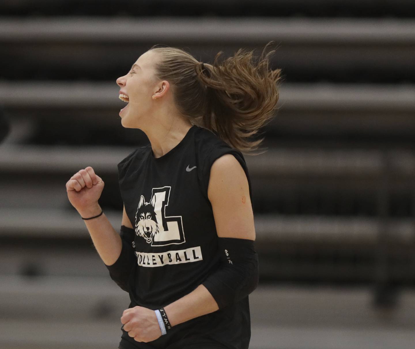 Loyola volleyball player Grace Hinchman celebrates a point during practice.