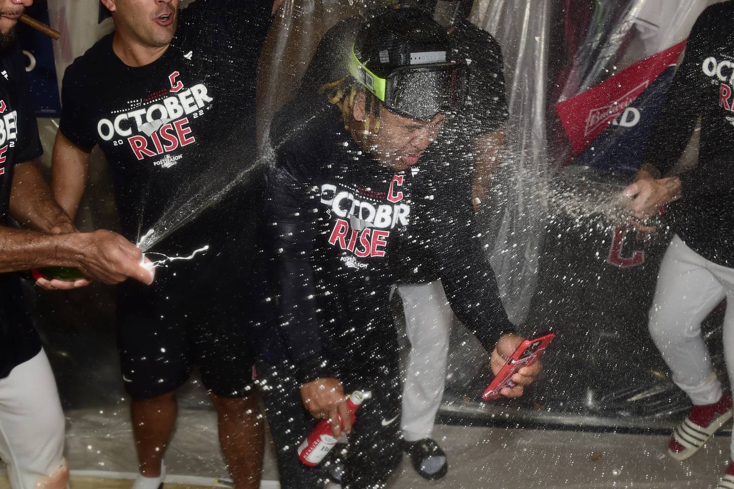 Third baseman José Ramírez is drenched in the clubhouse after the Guardians defeated the Rays 1-0 in 15 innings Saturday in Cleveland, advancing to the division series. 