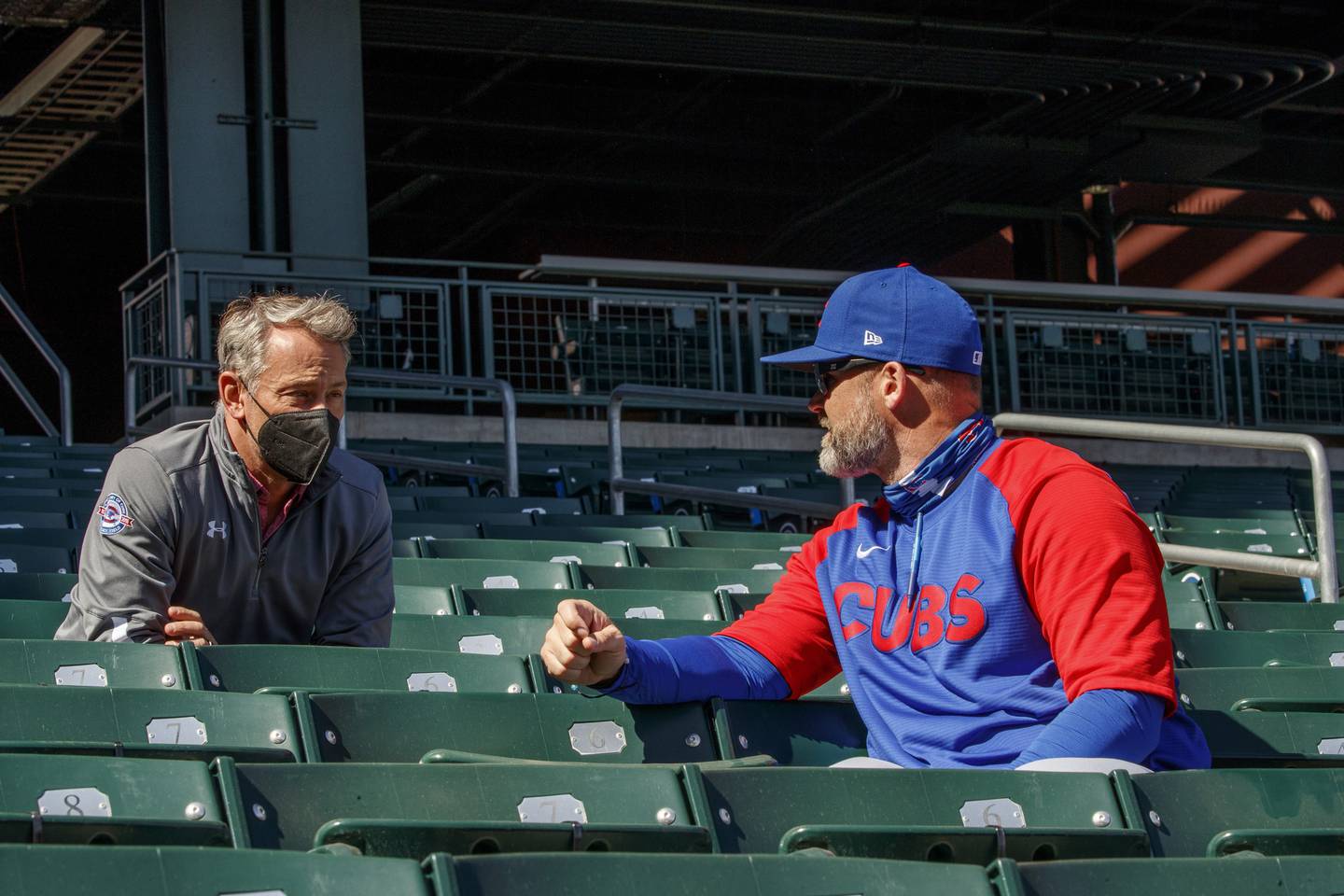 Cubs President Jed Hoyer talks with manager David Ross during Cubs spring training on Feb. 25, 2021, at Sloan Park in Mesa, Ariz. 