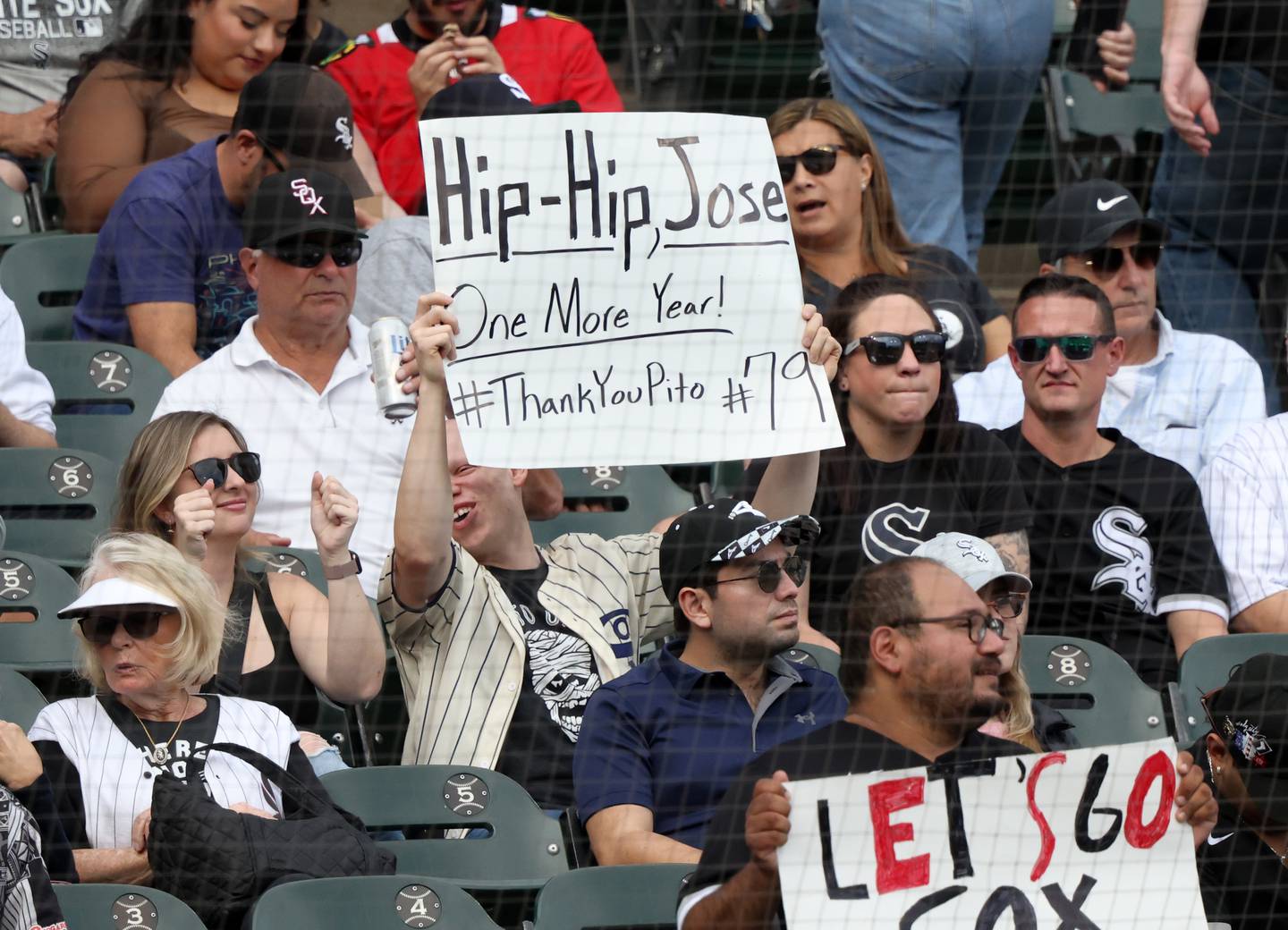 A fan holds up a sign in support of White Sox first baseman José Abreu in the first inning at Guaranteed Rate Field on Oct. 5, 2022.