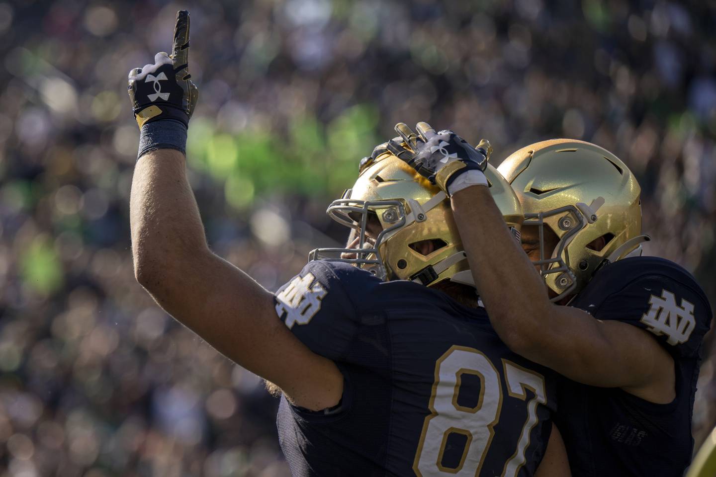 Notre Dame tight end Michael Mayer, left, celebrates a touchdown reception with wide receiver Braden Lenzy during the first quarter against UNLV on Saturday in South Bend, Ind.