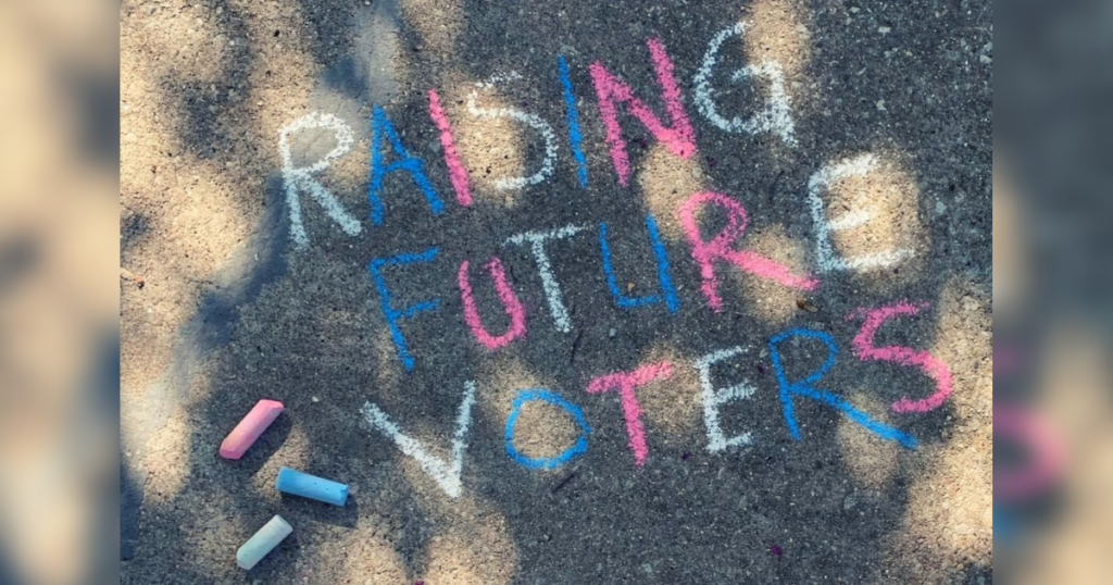 Families in Chicago #ChalkTheVote at Logan Square train station, create chalk Art with messages urging parents to vote