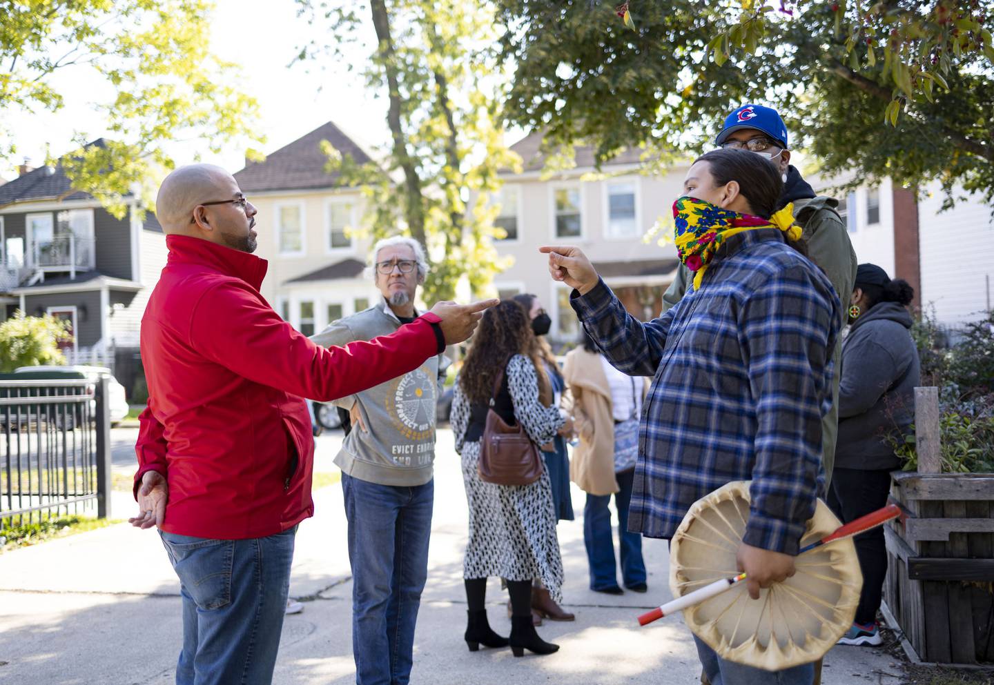 Ald. Andre Vasquez, left, has a discussion with members of the Chi-Nations Youth Council after their protest disrupted an Indigenous Peoples Day celebration on Oct. 10, 2022.