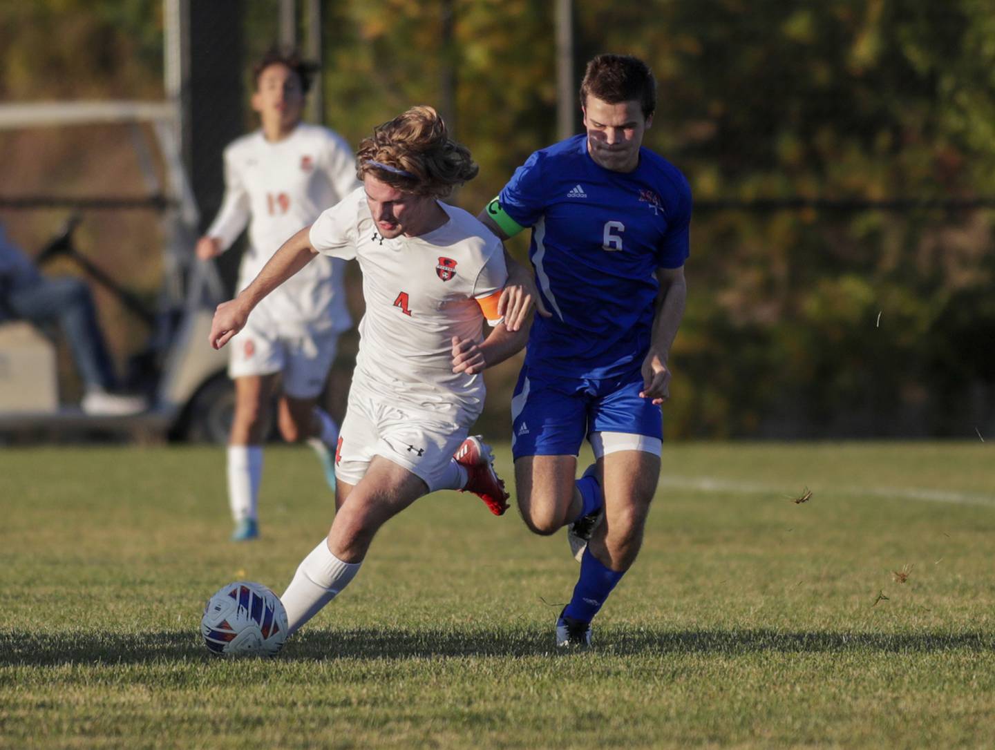 Oswego’s Ian Laird (4) moves the ball against Marmion’s Matthew Powell (6) during a nonconference game in Aurora on Wednesday, Oct. 12, 2022.