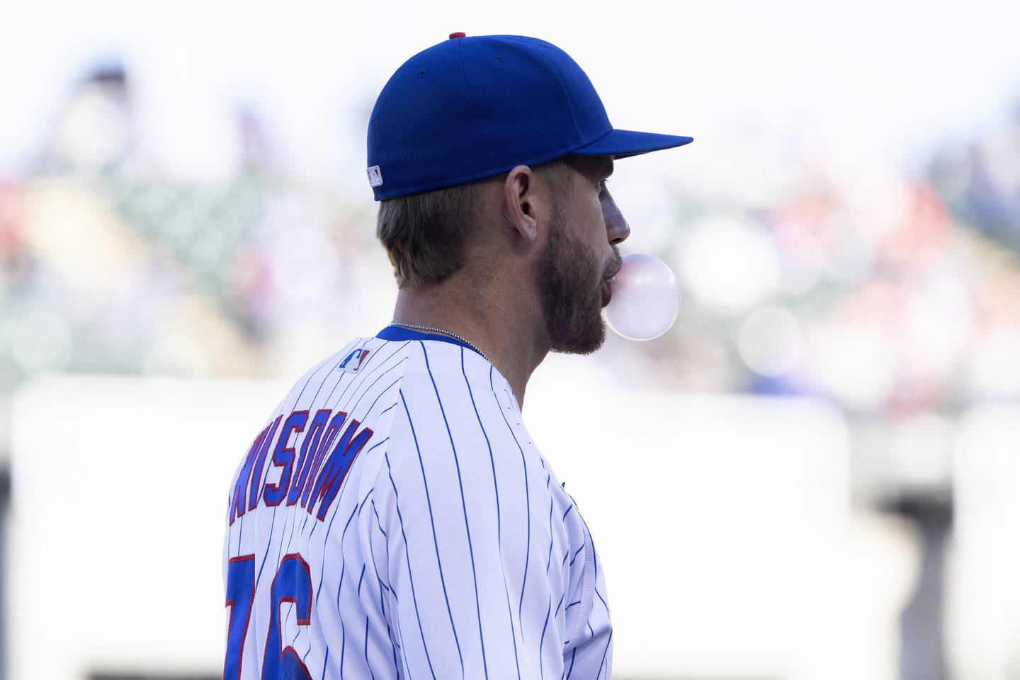Cubs third baseman Patrick Wisdom blows a bubble during the ninth inning on Sept. 29, 2022, at Wrigley Field.