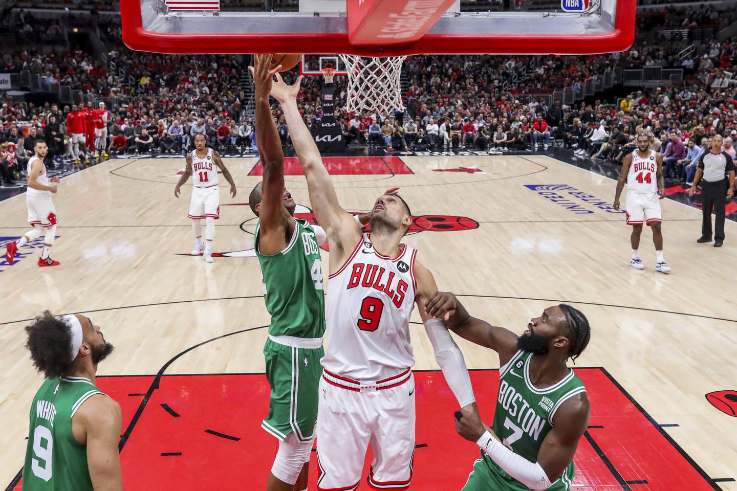 Bulls center Nikola Vučević goes up for a rebound during the second half against the Celtics at the United Center on Oct. 24, 2022.