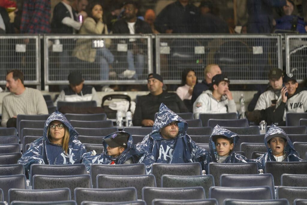 ALDS Game 5 rescheduled for Tuesday, fans sit in rain for nearly three hours in ‘terribly handled’ delay