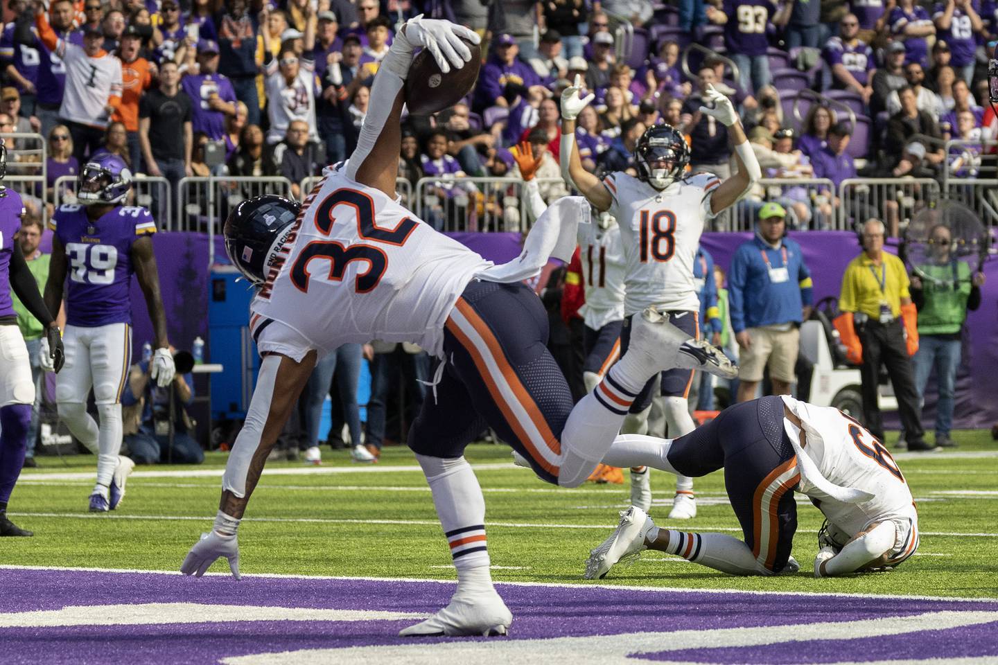 Bears running back David Montgomery scores a touchdown during the second quarter against the Vikings at U.S. Bank Stadium on Oct. 9, 2022.