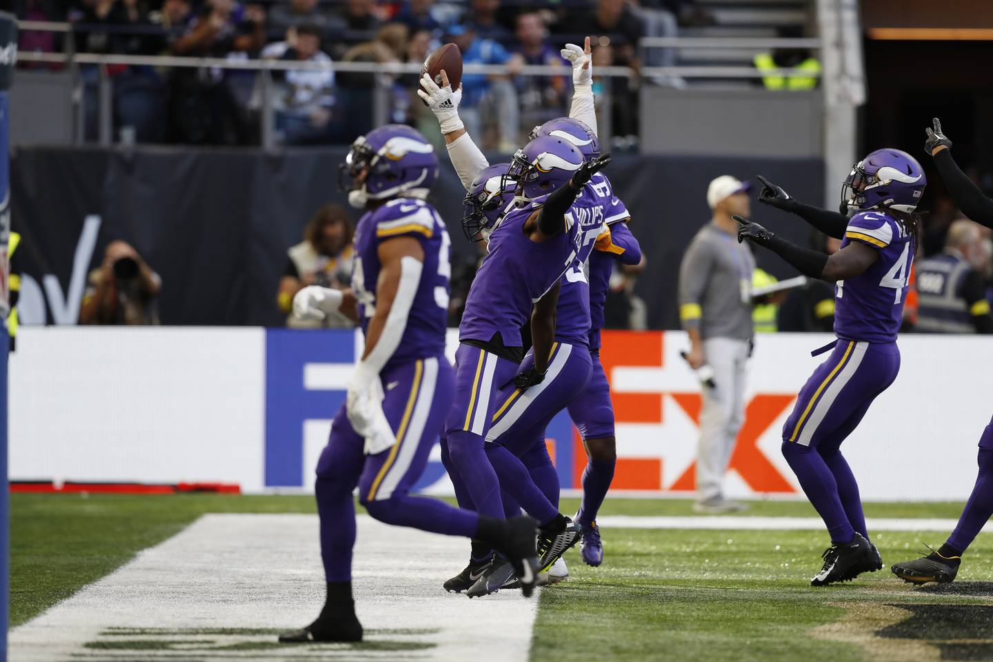 The Vikings defense celebrates after a play against the Saints on Sunday at Tottenham Hotspur Stadium in London. 