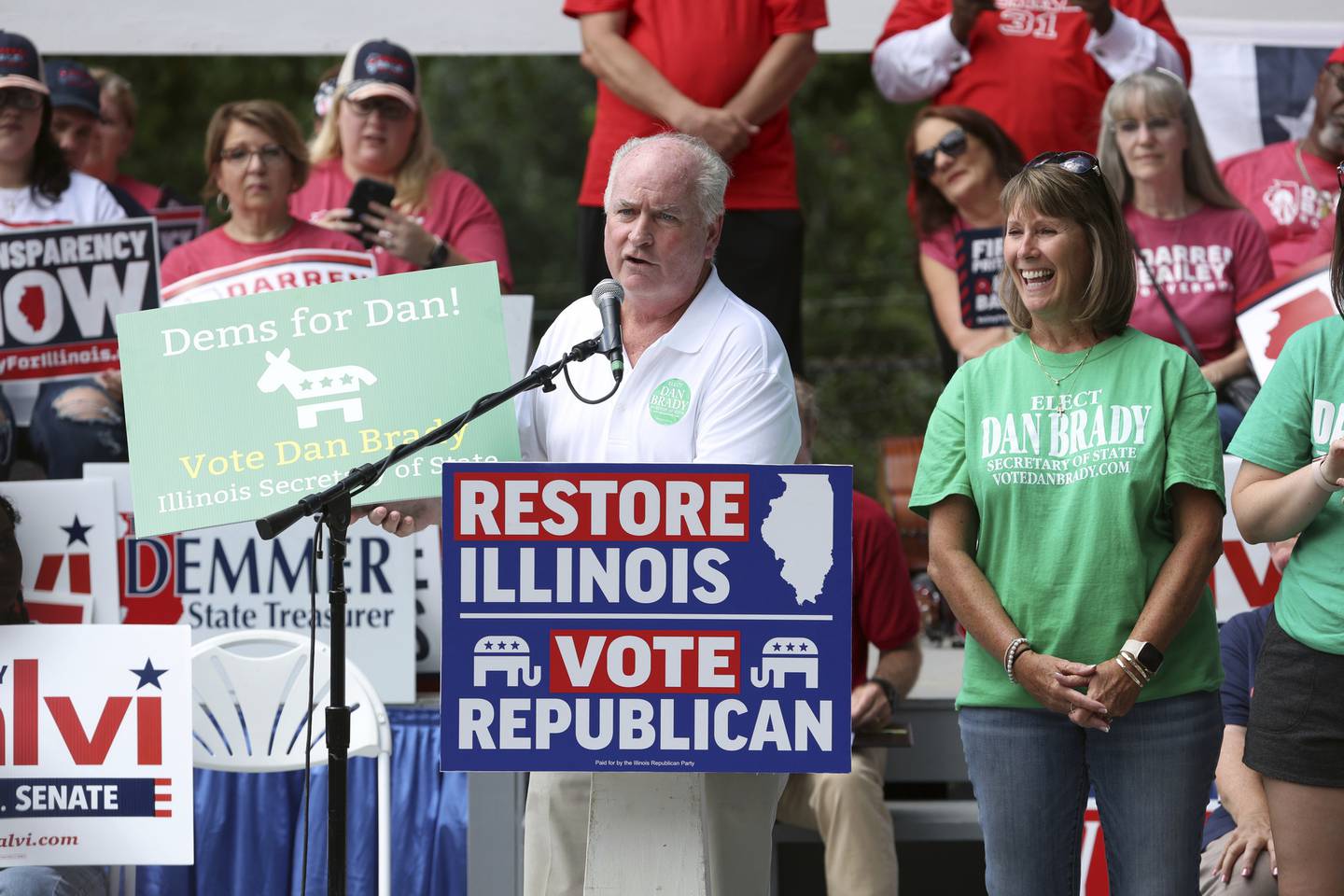 Dan Brady, Republican candidate for Illinois secretary of state, accompanied by his wife, Teri, delivers a speech on Republican Day at the Illinois State Fair in Springfield, Aug. 18, 2022. 