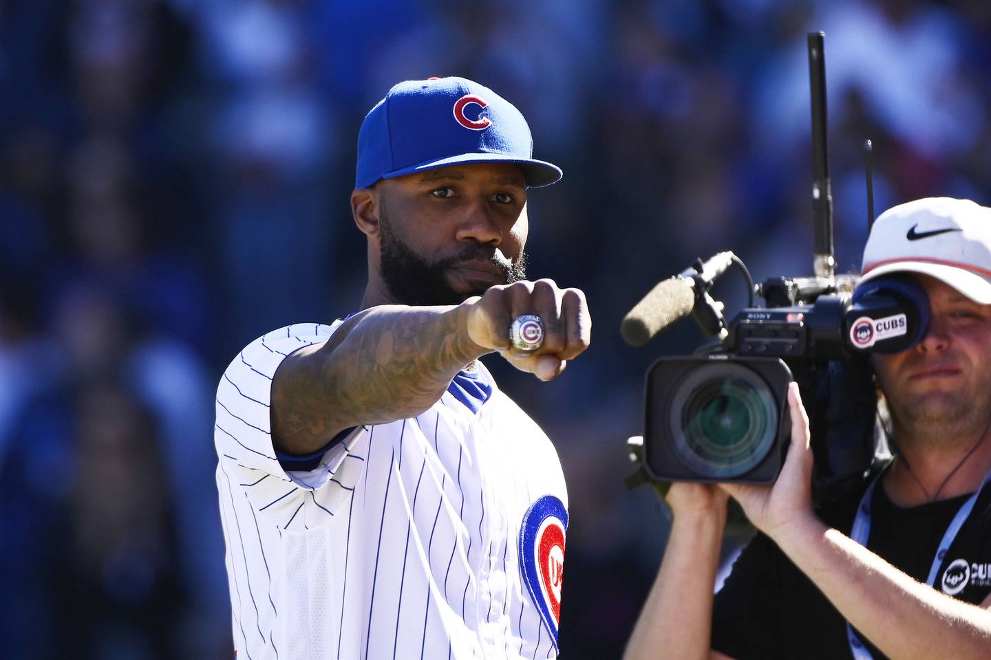 Cubs outfielder Jason Heyward, shows off his World Series ring while being honored during the team's game against the Reds on Saturday at Wrigley Field. 