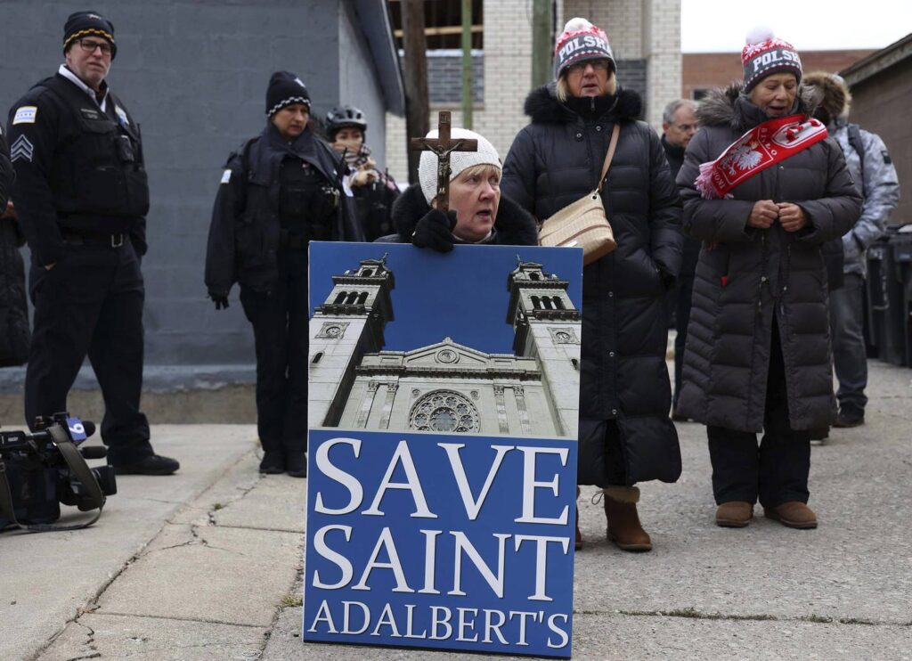 Protesters rally against removal of La Pieta statue from St. Adalbert Church in Pilsen; permit issue holds up the move