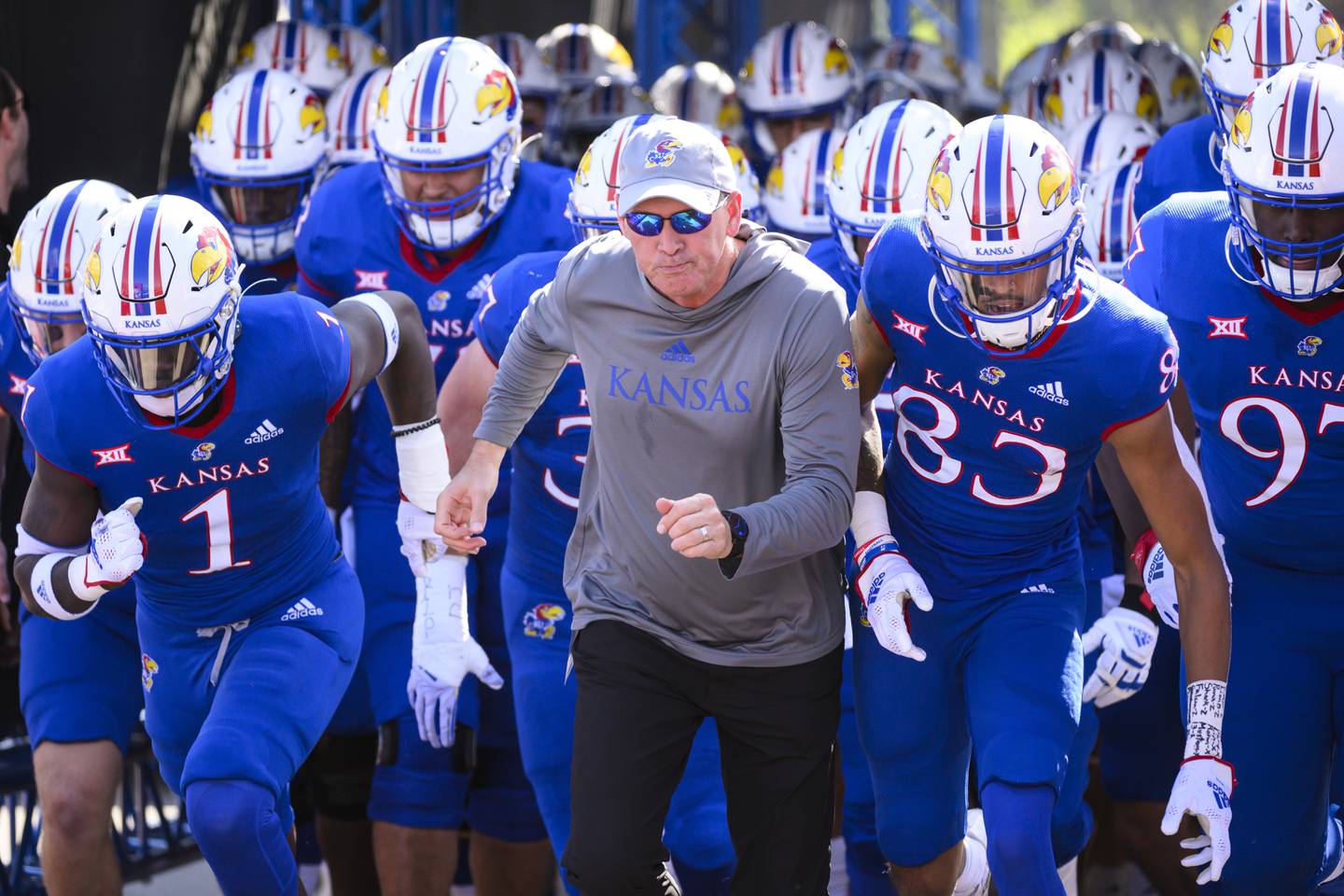 Kansas coach Lance Leipold enters the field with his team before a game against Iowa State on Oct. 1, 2022, in Lawrence, Kan.