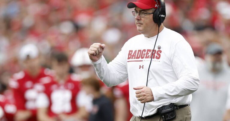 Editorial: On, Wisconsin! On to the bank! College football cashes in while players get peanuts.