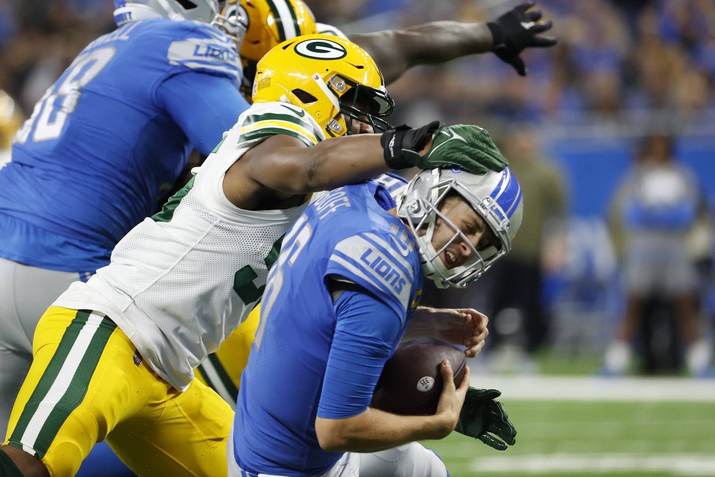 Packers linebacker Kingsley Enagbare, left, hits Lions quarterback Jared Goff in the head during the second half Sunday in Detroit. 