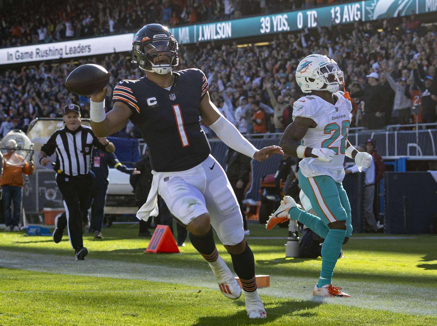 Chicago Bears quarterback Justin Fields (1) runs for a 61-yard touchdown against the Miami Dolphins in the third quarter, Nov. 6, 2022, at Soldier Field.