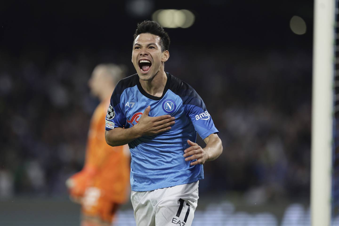 Napoli's Chucky Lozano celebrates after scoring the opening goal during a Champions League match against Ajax on Oct. 12, 2022, in Naples, Italy.