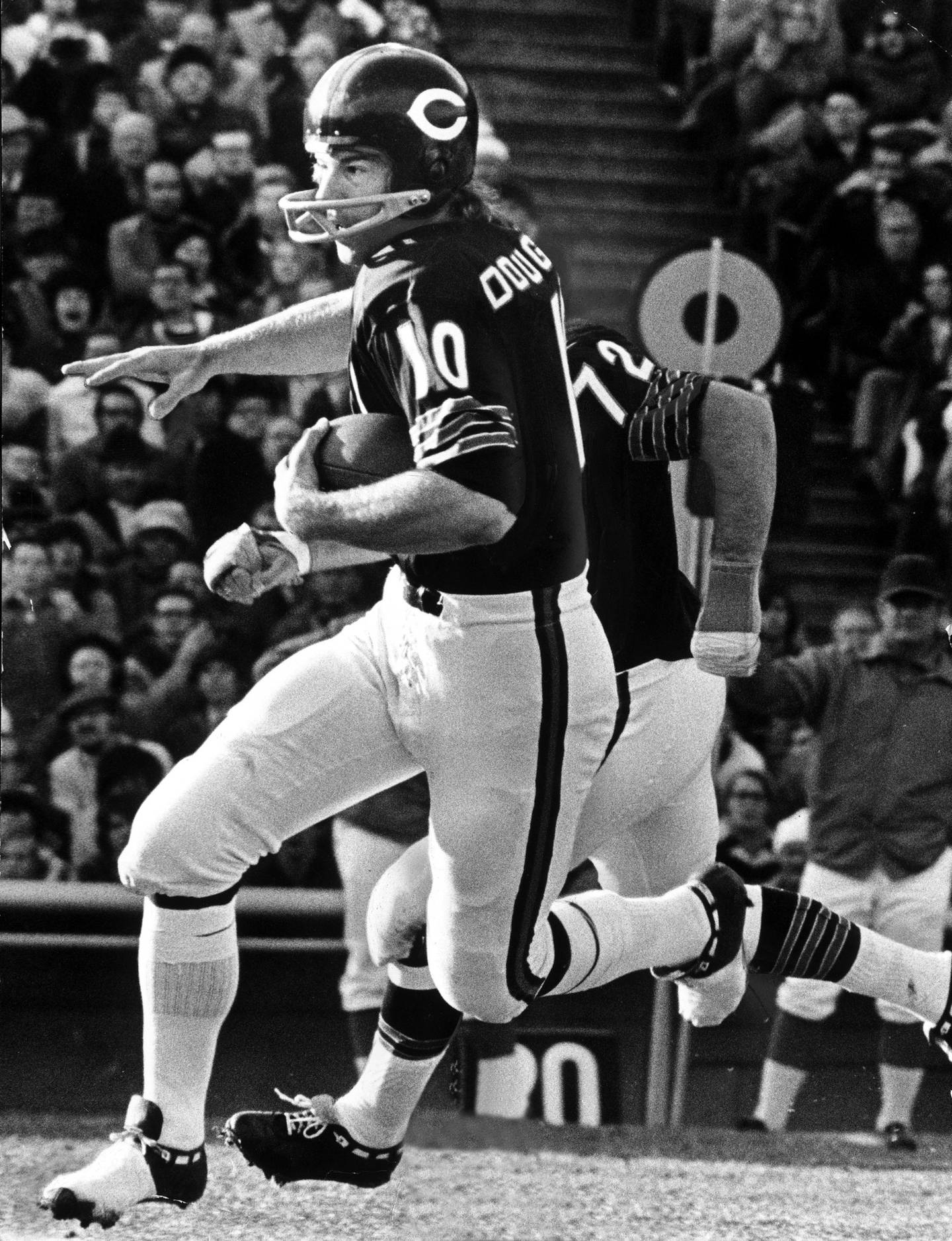 Bears quarterback Bobby Douglass runs for daylight during a 1972 game.