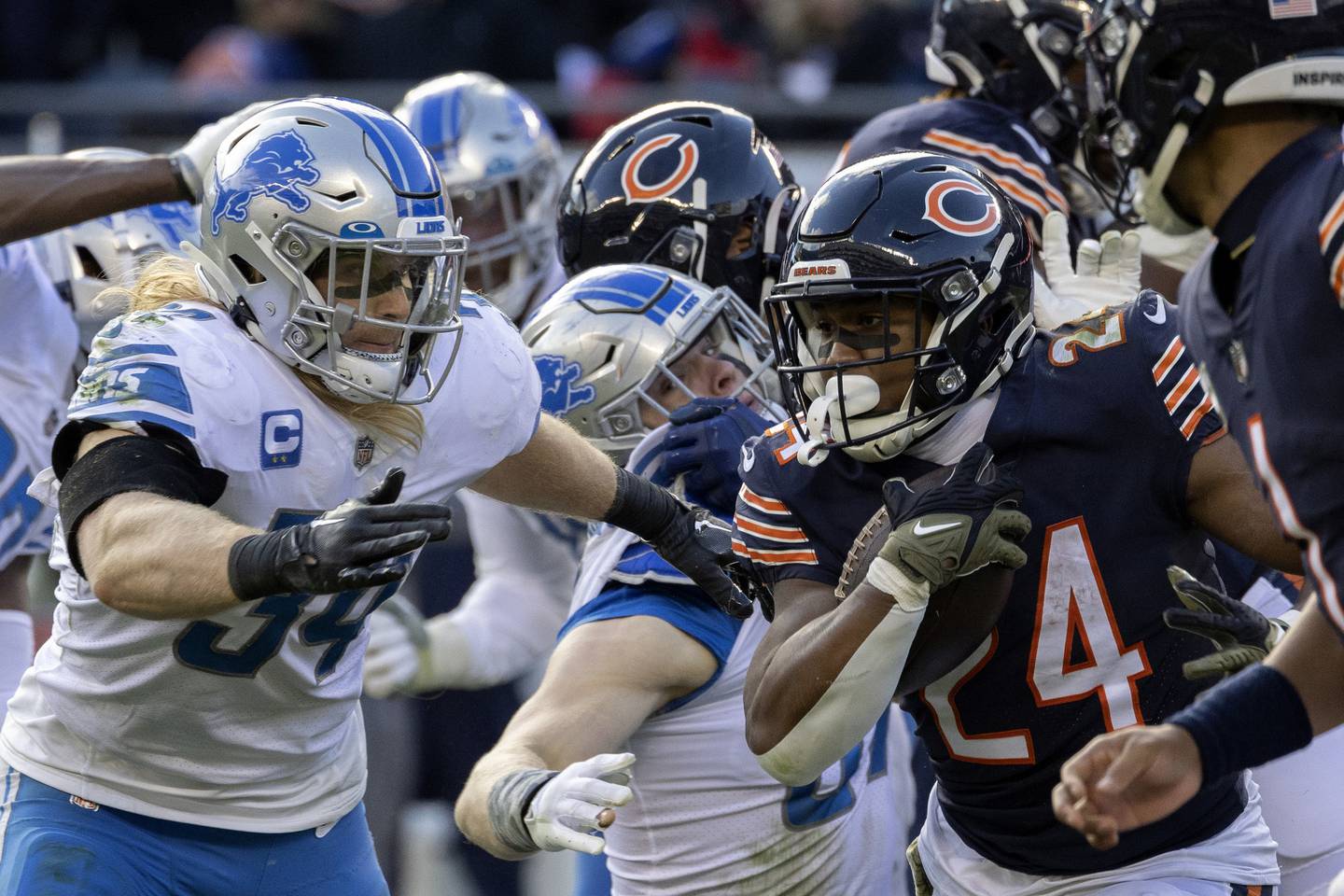 Bears running back Khalil Herbert (24) carries the ball during the fourth quarter against the Lions on Sunday at Soldier Field. 